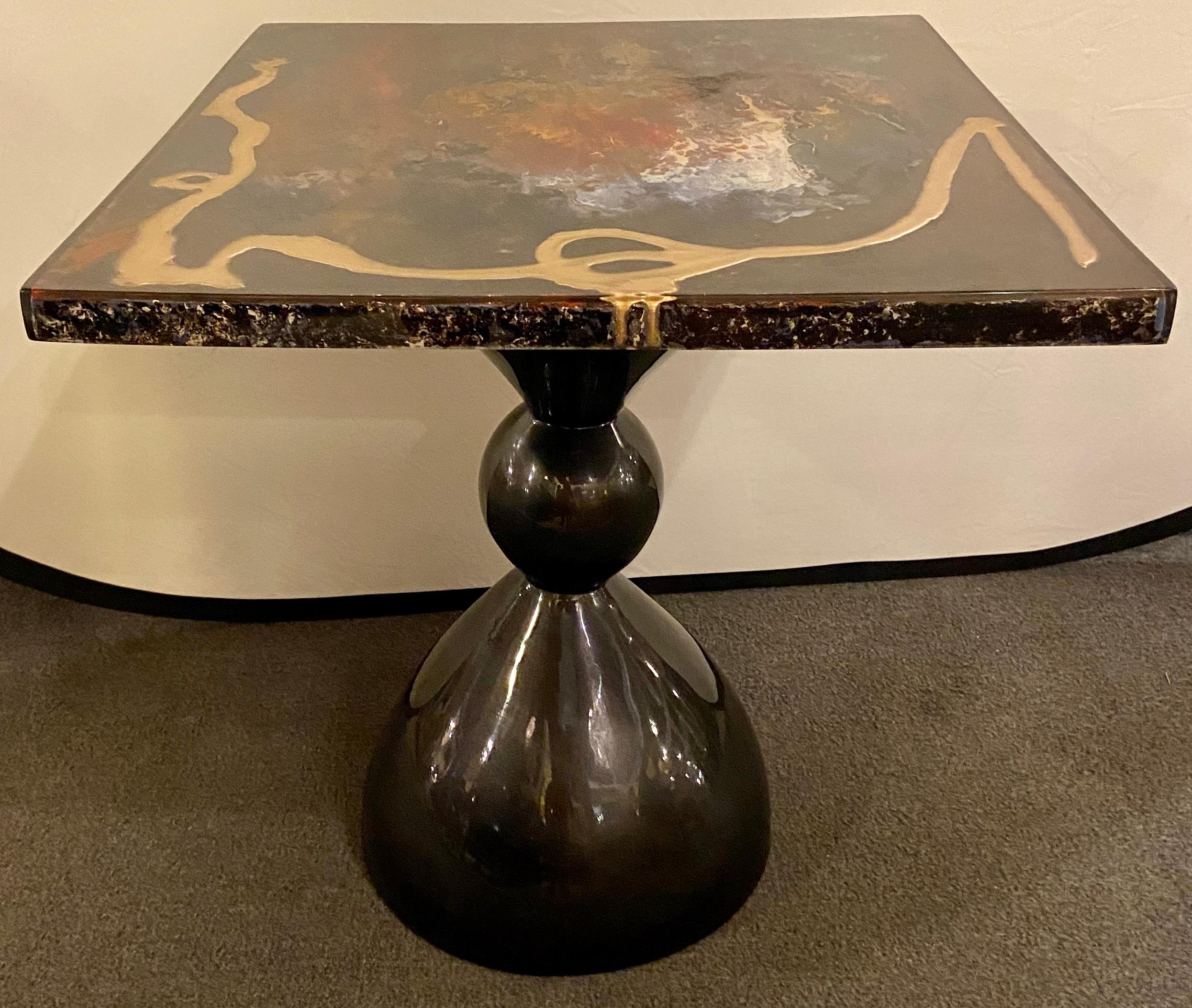 Abstract Design Mid-Century Modern Center or End Table in Resin on Black Epoxy

The square shaped center or end table is assembled to create a unique blent of modern art and abstract design. Using multi-color resin design on black epoxy, the