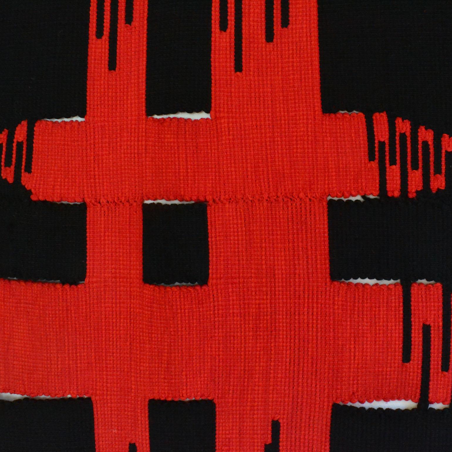 Modern abstract art hand woven tapestry by Dutch artist Liesbeth Wiersma in red and black 1969 has been traditionally woven in wool by hand on a loom in a technique called Kelim. The artist explores the boundaries of abstract expressionism through