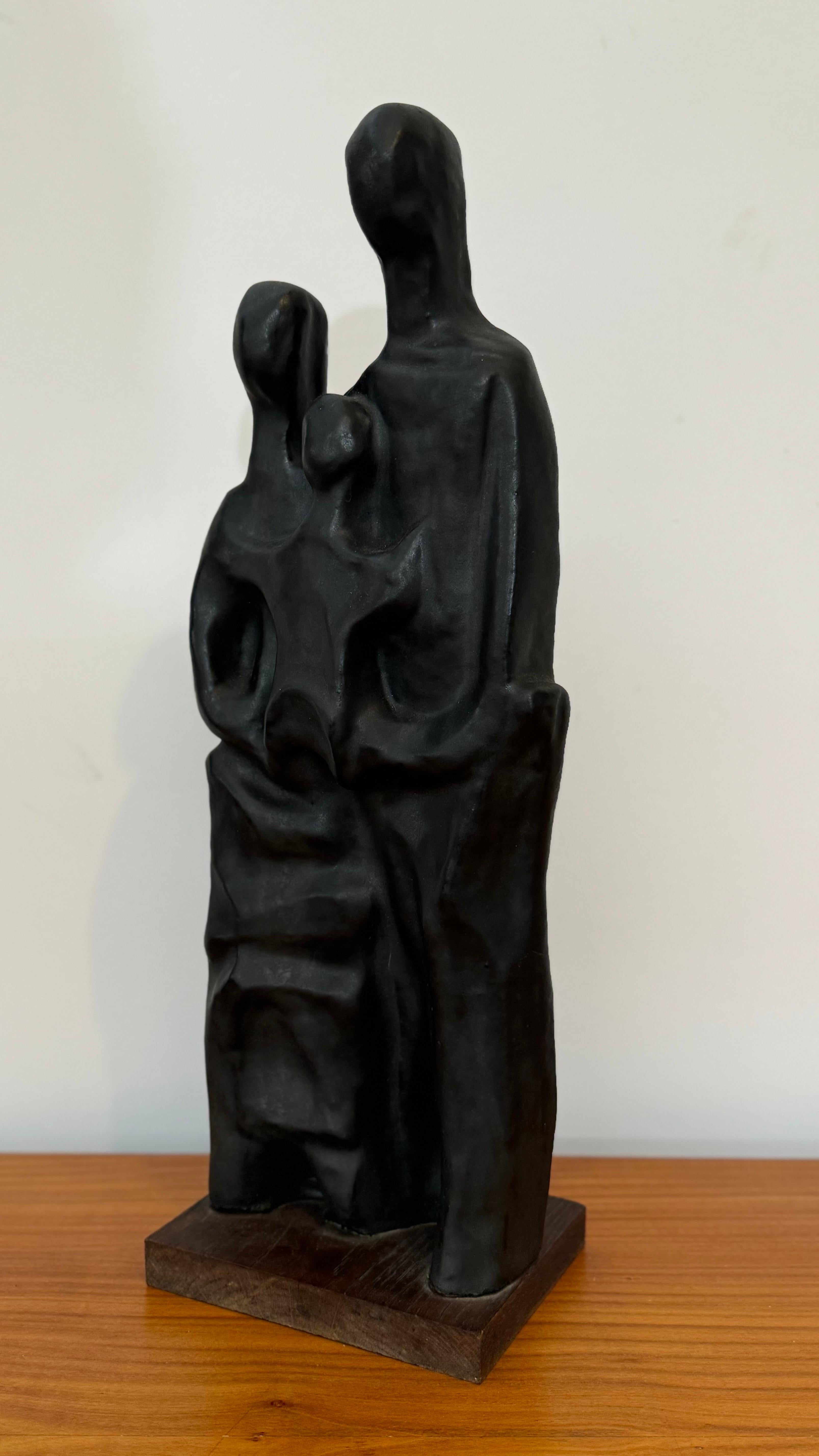 Abstract mother, father and child sculpture hand molded in black glaze by Elie Van Damme manufactured by Amphora Belgium, 1960s.
