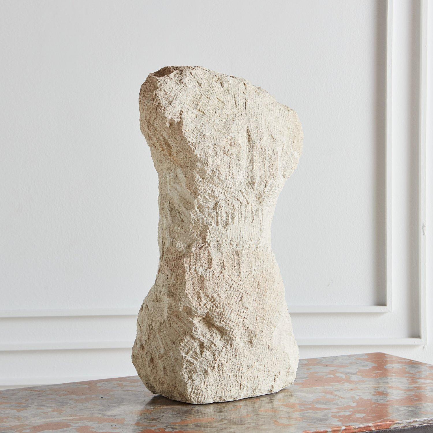 A vintage figural limestone sculpture with porous textural details. A beautiful, organic piece perfect for styling. Unsigned. Sourced in France, 1980s.