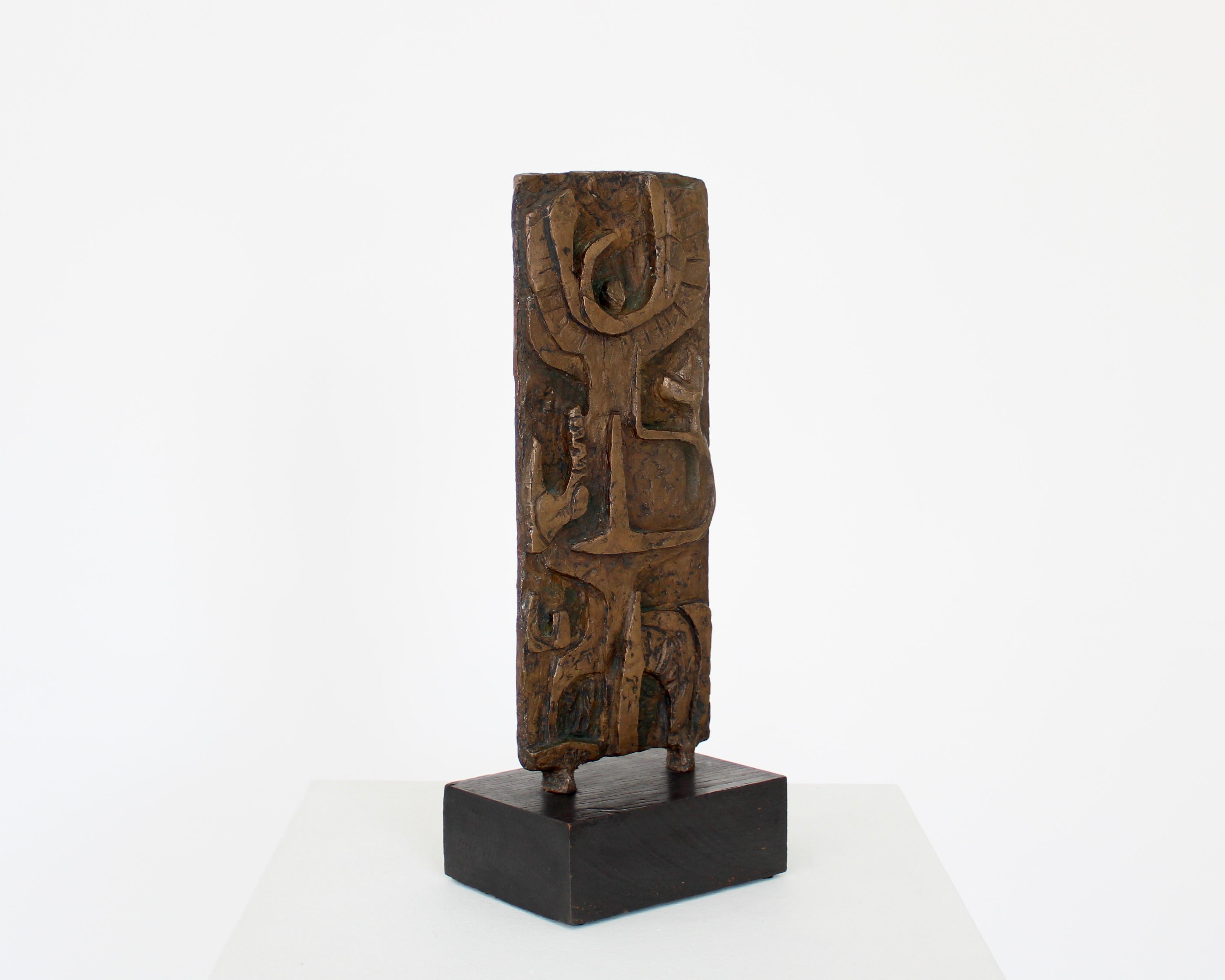 An Abstract animated figurative American bronze sculpture on black wood mount. 
Signed with MM on recto and verso. Unknown artist. 20th c
Very finely executed and animated with deep attention to detail of the various figurative motifs. 
Orignal