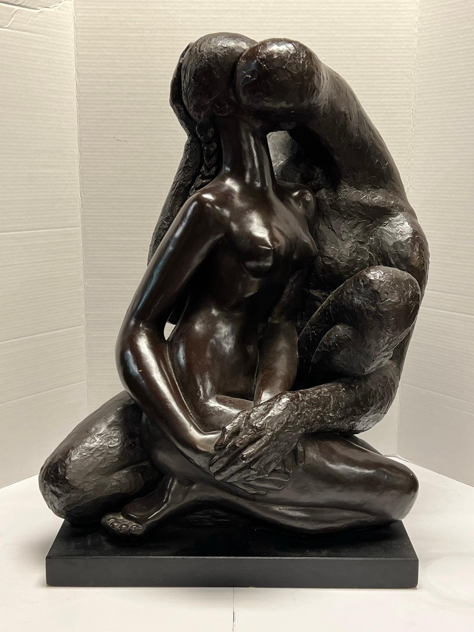 Painted plaster sculpture in the brutalist style by the Cuban sculptor, Manuel Carbonell (1918-2011), depicting seated, embraced figures of a grotesque and abstract male kissing a lovely nude female.  Produced by Austin Productions, circa 1990s. 
