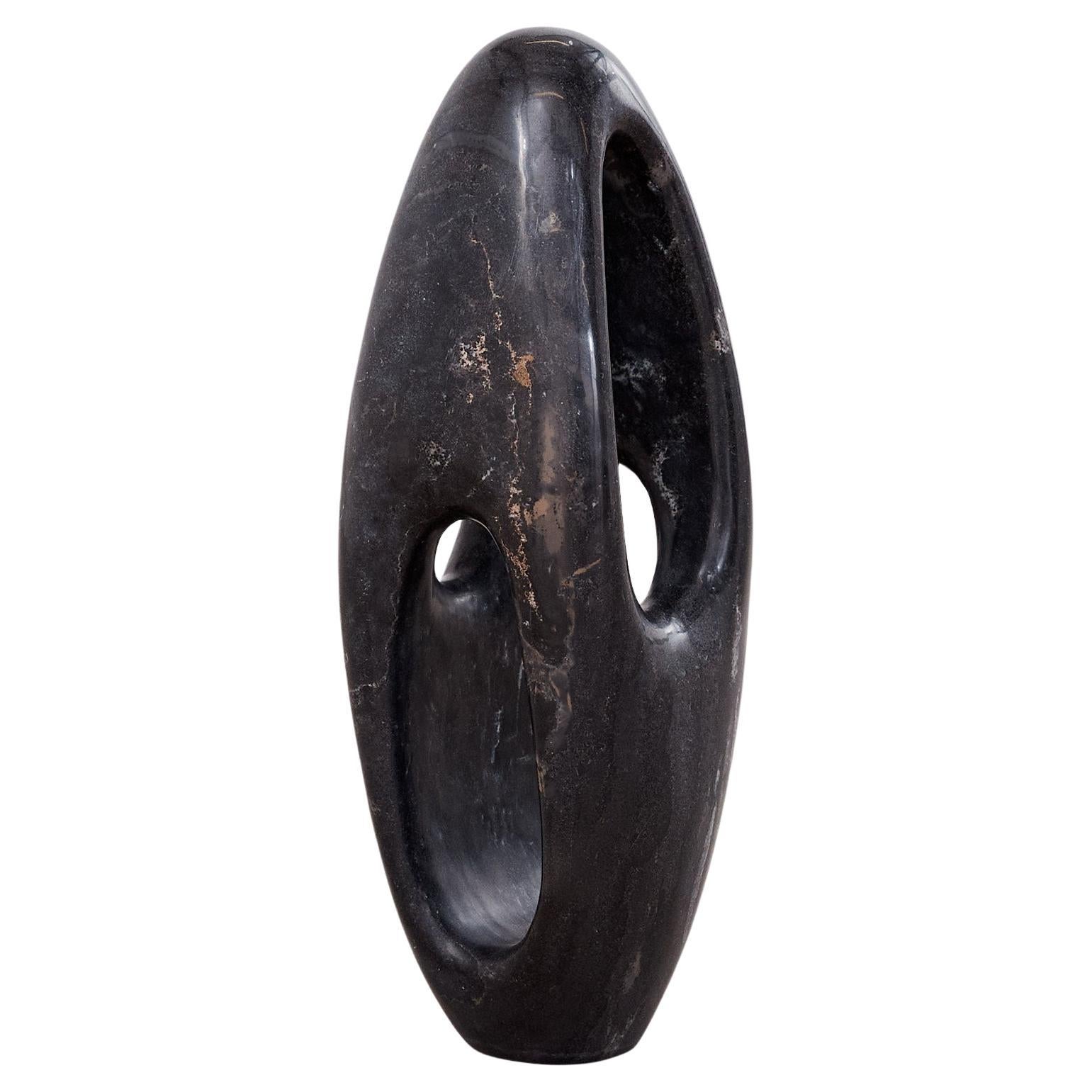 Abstract floor standing sculpture in Belgian granite For Sale