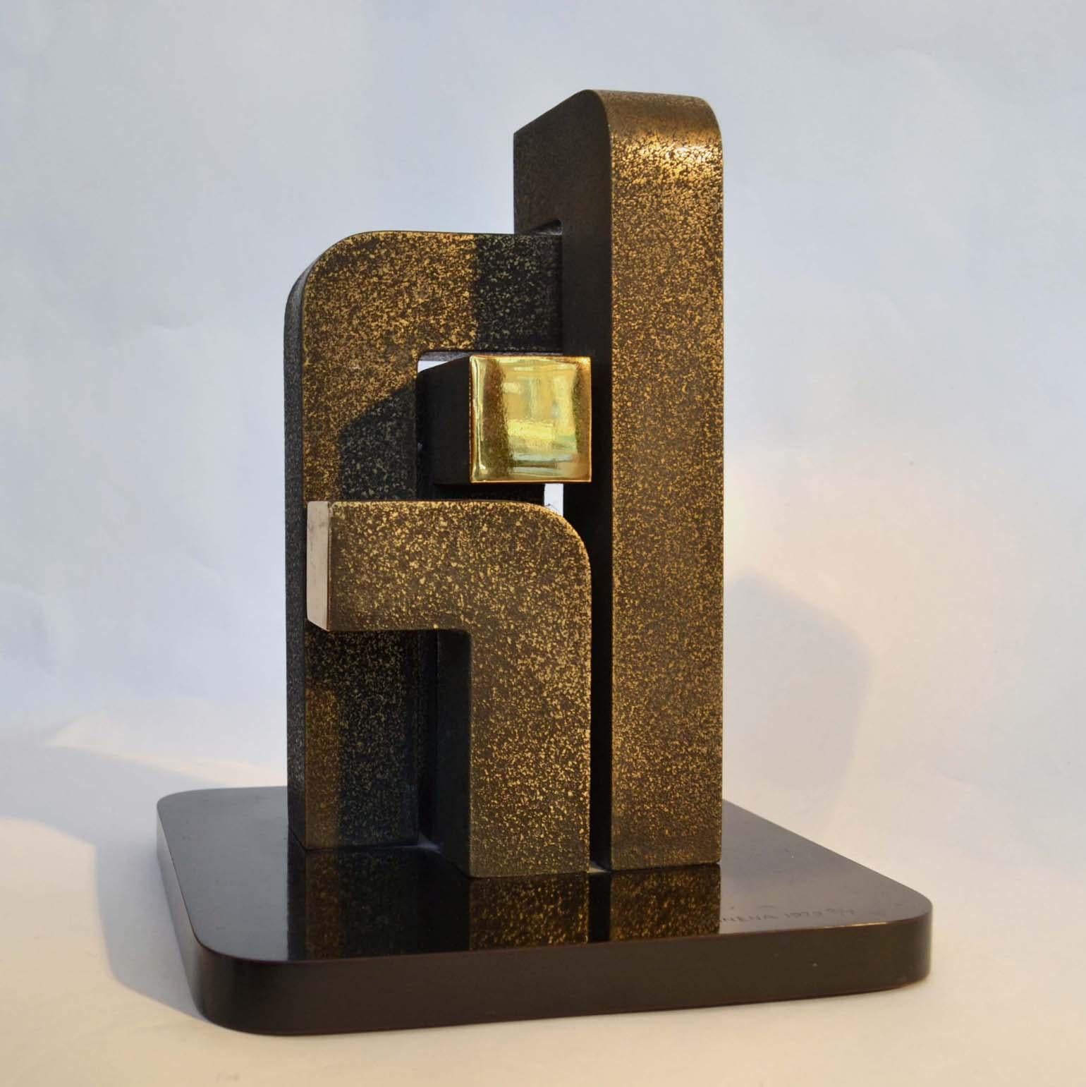 Minimalist abstract geometric sculpture by Zonena, 1979, is an edition of 2/7 bronzes. The balanced composition of 4 leaning columns like modules of form with repeating finishes that emphasized the contrast between the rough texture and highly