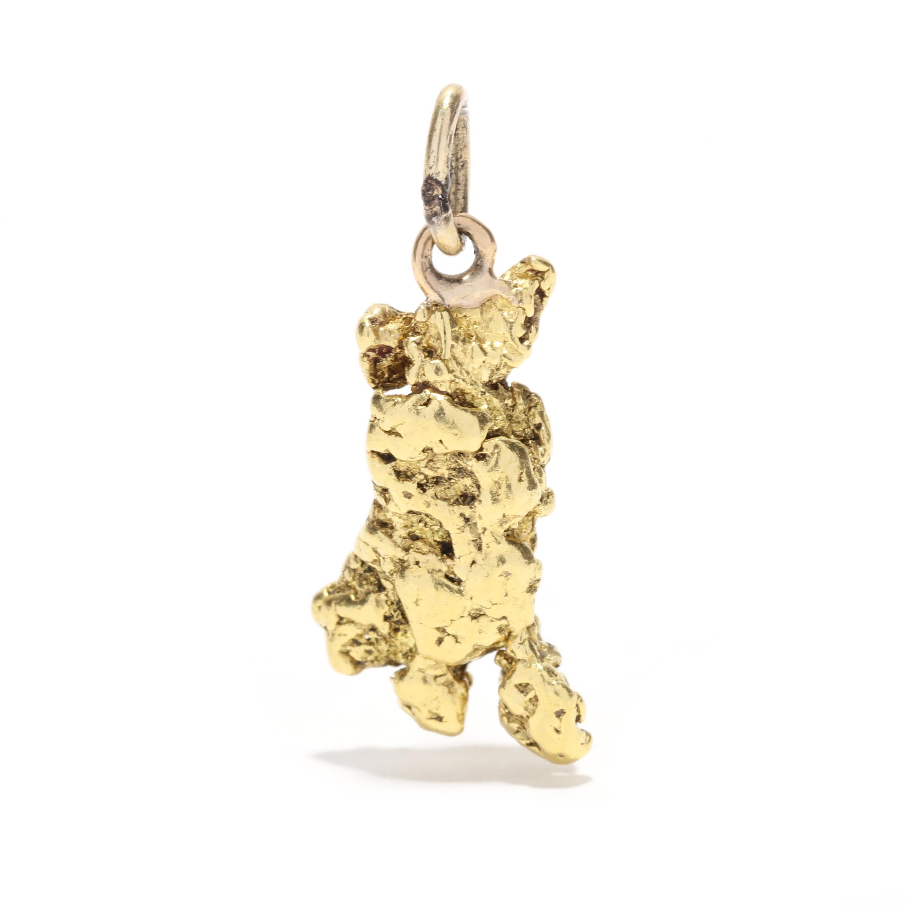 A vintage 18 karat yellow gold abstract gold nugget charm. This three dimensional charm features a natural gold nugget for with a thin bail.

Length: 7/8 in.

Width: 3/8 in.

Weight: 3 dwts. / 4.67 grams

Metal: Tested 18KT

Ring Sizings &