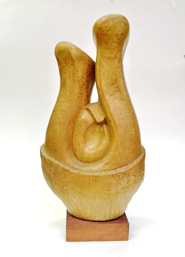 This Henry Moore style organic abstract possibly depicts Lovers, a husband and wife with a young child in between them. The large hand carved wooden sculpture was done by artist Laszlo Feldman, in the 1970s. Heavy, massive piece with a beautiful
