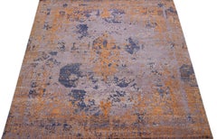 Tappeto astratto in lana e seta fatto a mano in blu e arancione