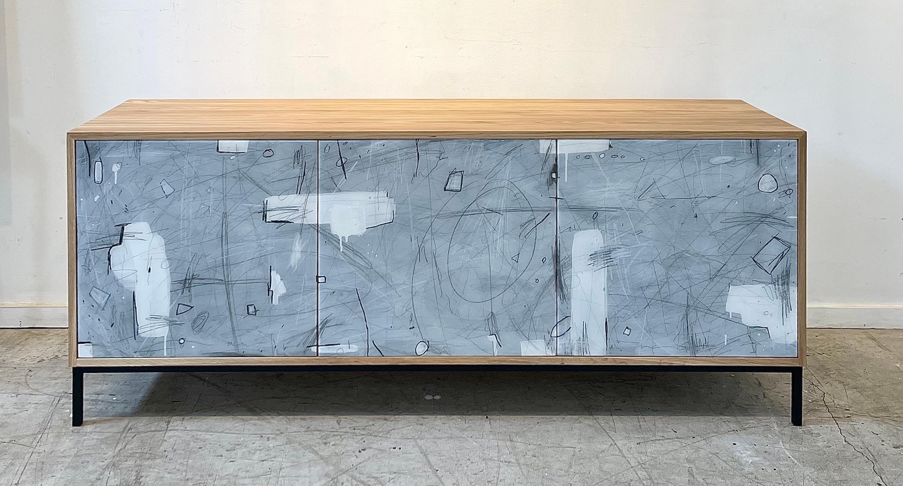 The Abstract in White credenza is created and painted by hand in our Toronto studio.

The artwork is by artist Murray Duncan. 

Based on an abstract interpretation of graffiti and freely-scribed, calligraphic working with solid fields and shape in