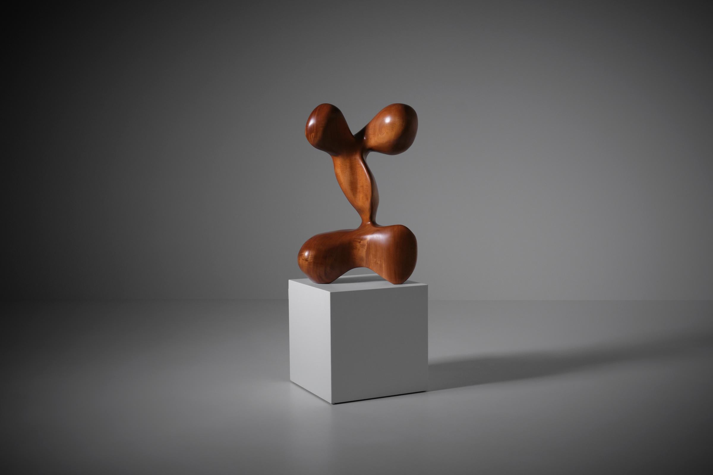 Abstract Iroko wooden sculpture, Italy 1960s. Beautifully hand-carved out of one piece of solid Iroko wood. Strong and interesting shapes show the refined skills of the artist. The sculpture is in excellent original condition.