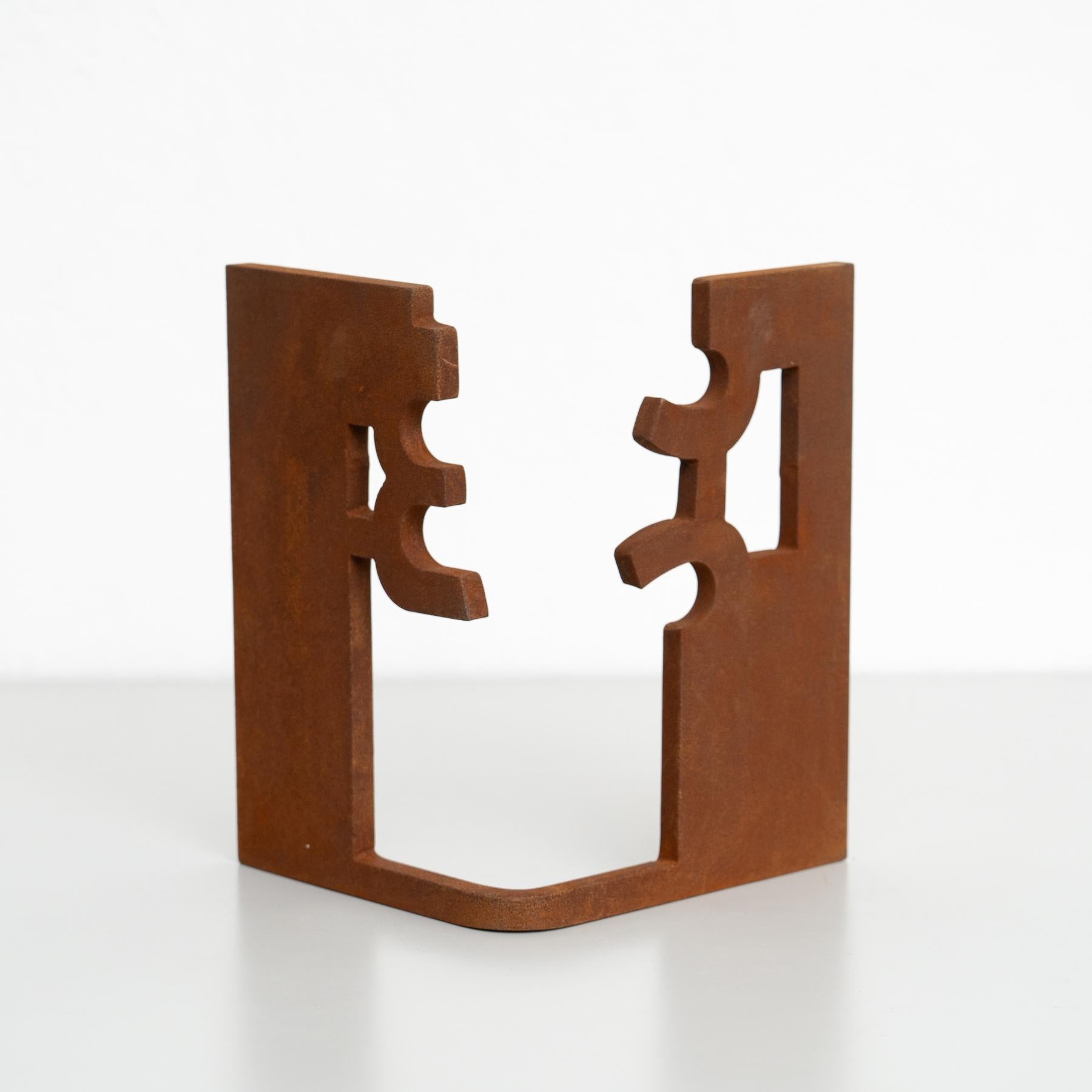 This exquisite abstract sculpture, crafted from iron, is a striking piece inspired by the bold and evocative works of renowned Spanish artist Eduardo Chillida. Made in Spain around 1990 by an unknown artist, it showcases the timeless beauty of