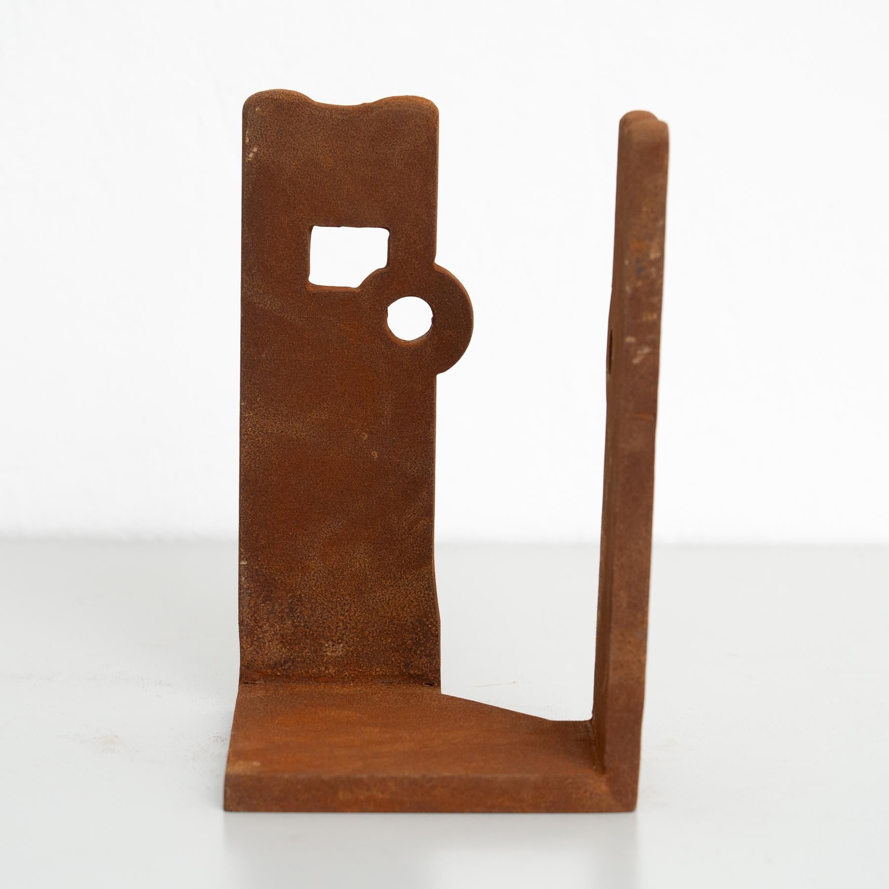 This exquisite abstract sculpture, crafted from iron, is a striking piece inspired by the bold and evocative works of renowned Spanish artist Eduardo Chillida. Made in Spain around 1990 by an unknown artist, it showcases the timeless beauty of