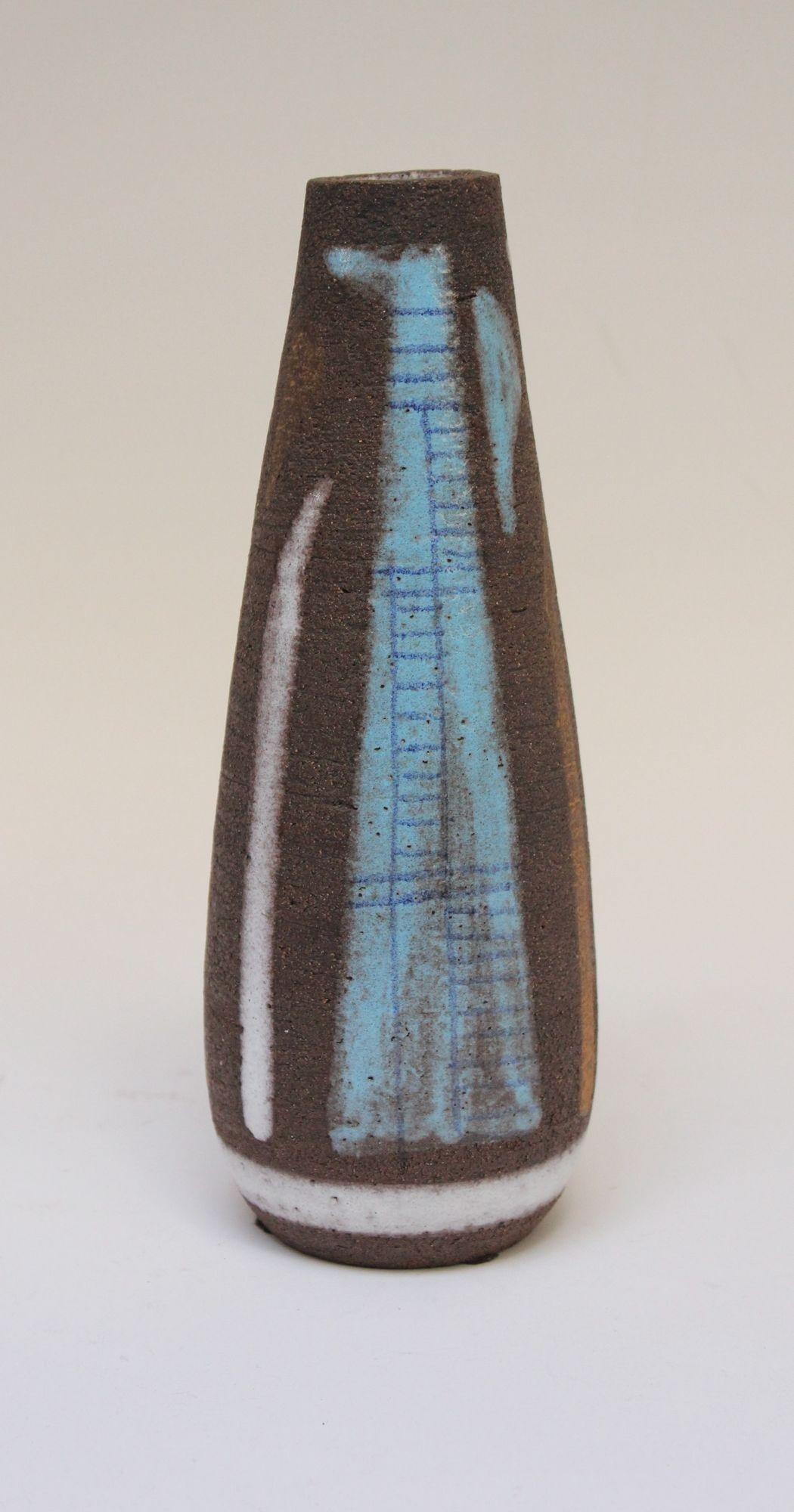 Attractive vase with abstract decoration in sky blue, brown, burnt orange, and white with linear decoration throughout (ca. 1960s, Italy).
Nice contrast between the smoothness of the blue and white glazes against the crudeness of the