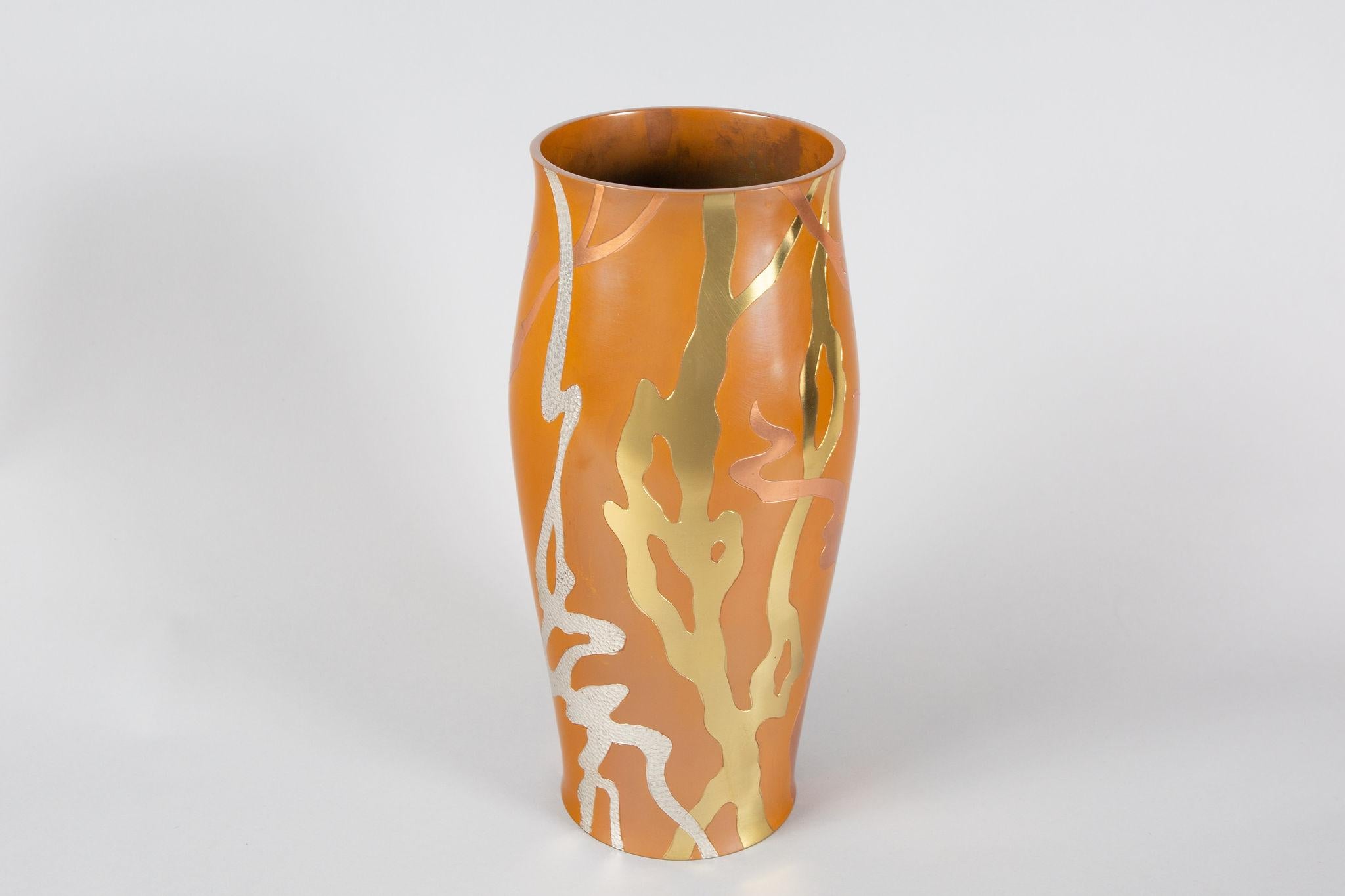 Modern bronze vase with inlay silver, and hammered metal to create an overlapping organic design. Signature reads: Shiho.