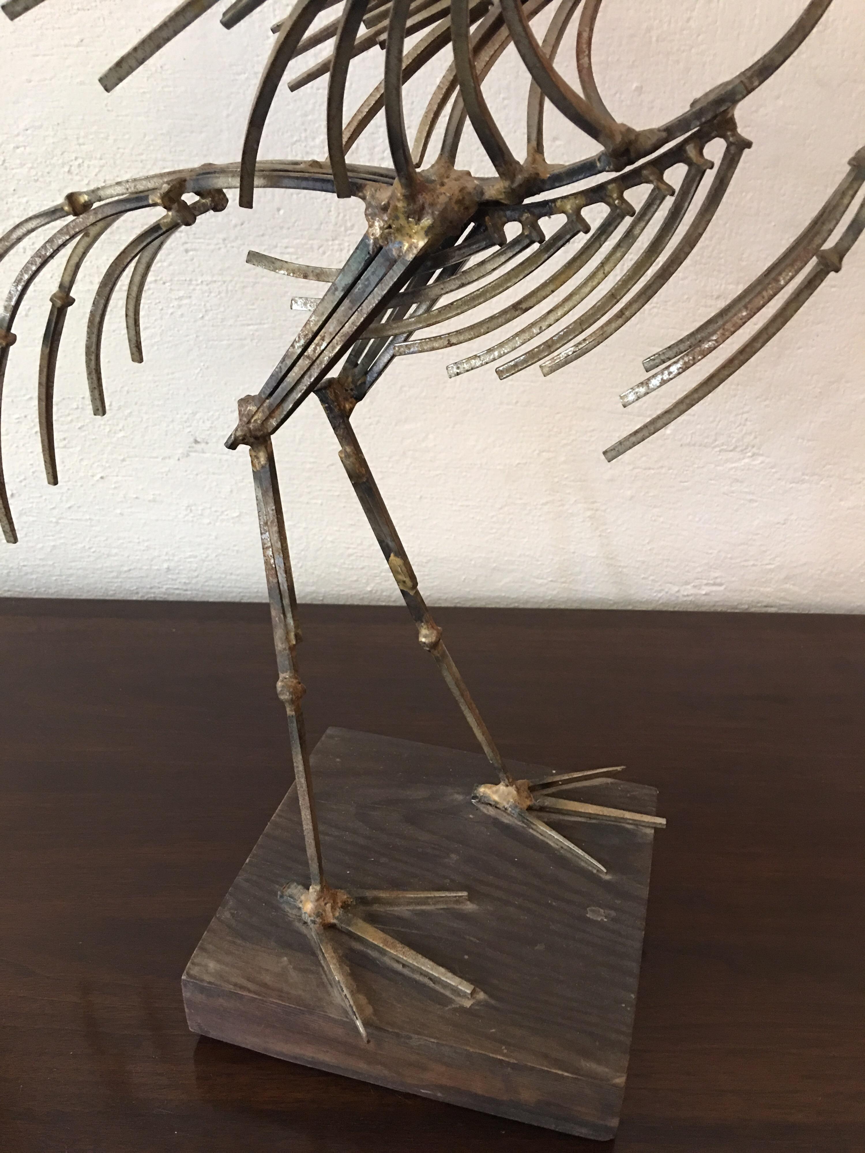 Entirely made of nails! Modern abstract bird with it's wings spread. Mounted on wood base.