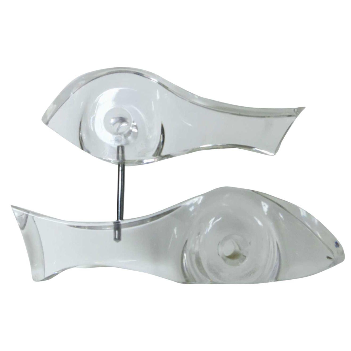 Mid-century era Abstract Lucite sculpture featuring two fish swinging in the shape of a yin-yang. The large bottom fish is a 10” long sculpture serving as the base, with a second Top fish being an 8.25