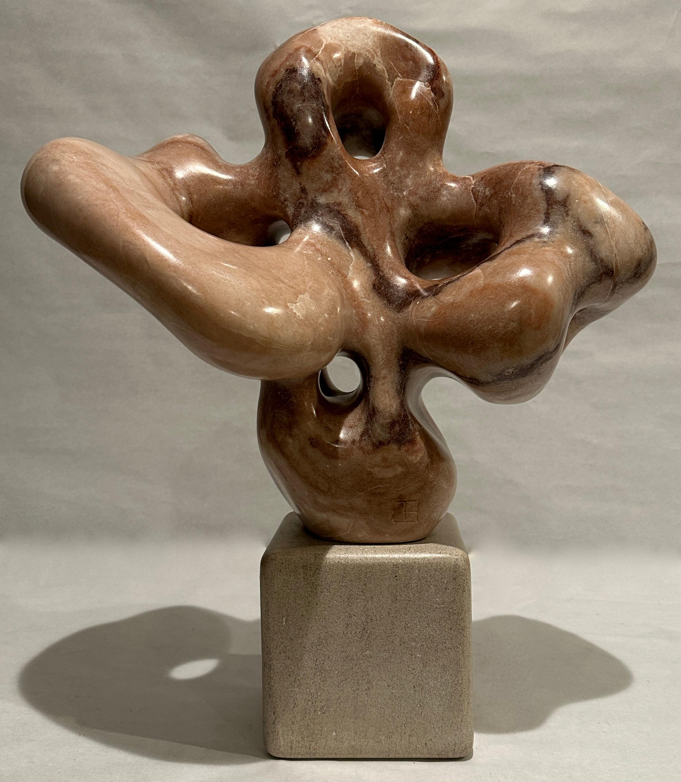 Biomorphic sculpture carved and polished from a block of marble by Orangeburg, NY sculptor Jeffrey Burtch. Executed c. 1980's. Marked with artist's initials. Raised on square limestone base.