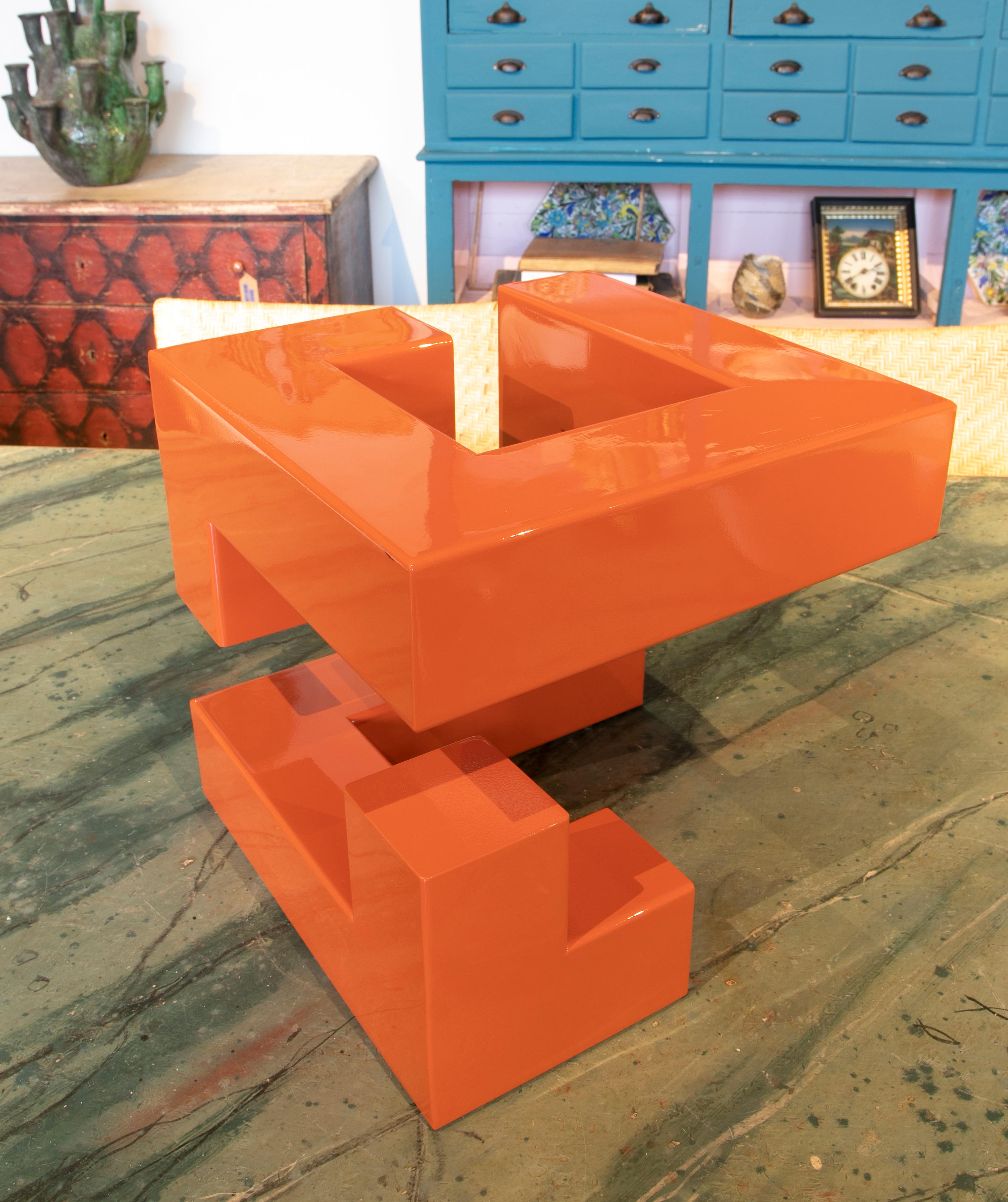 Abstract Metal sculpture Lacquered in orange with Geometric forms.