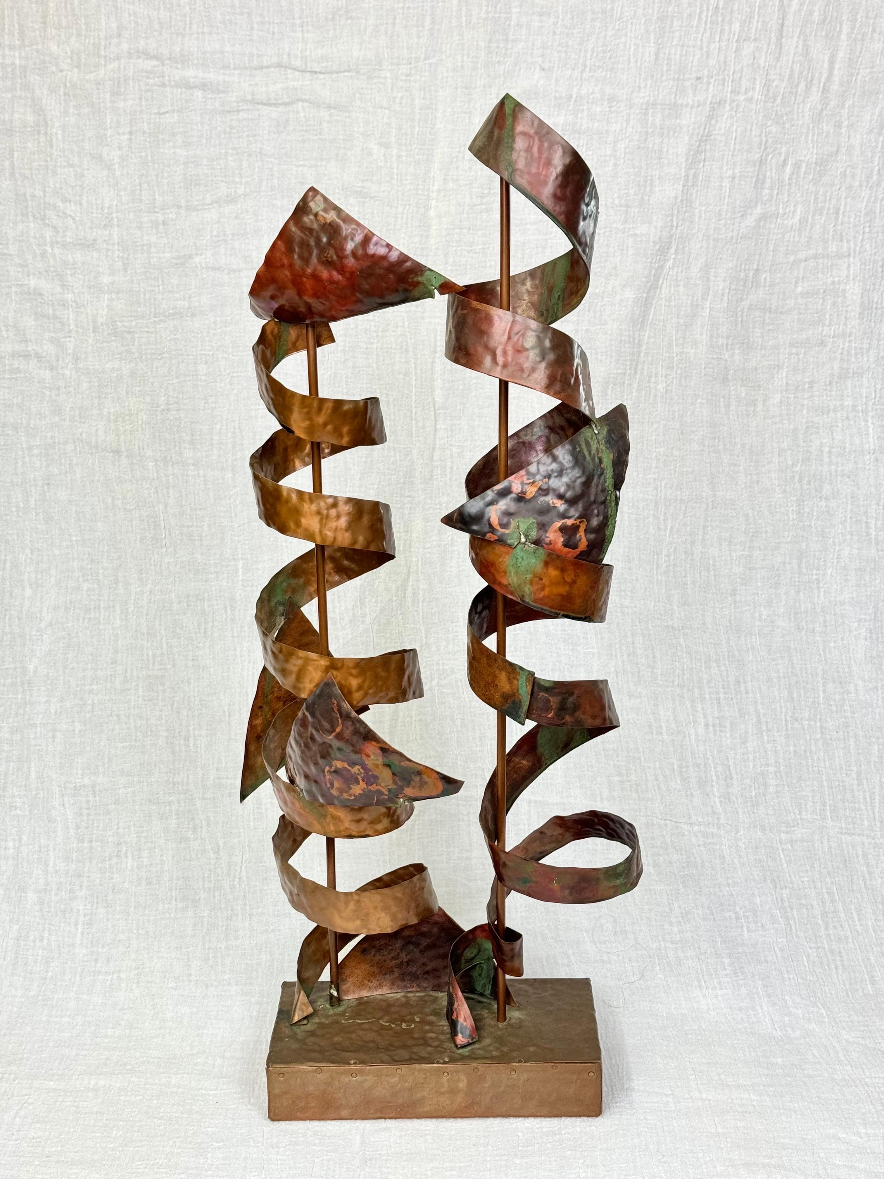 Abstract Mid Century Copper Sculpture in the style of Curtis Jere. Whimsical ribbon like swirls make up this decorative sculpture.