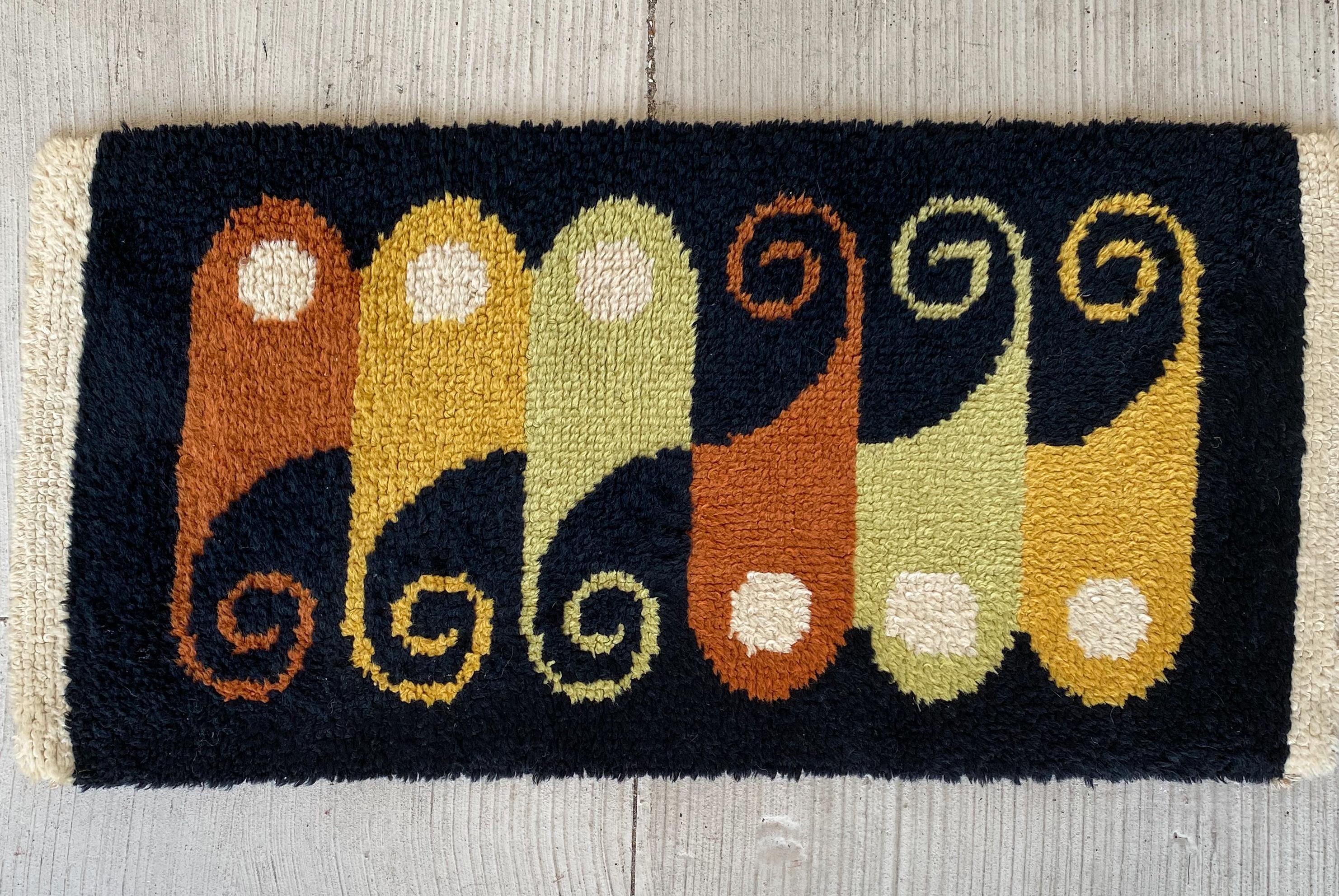 Hand knotted, small-scale wool rug with multi-color abstract pattern, circa 1960s, in the manner of Evelyn Ackerman for ERA Industries.