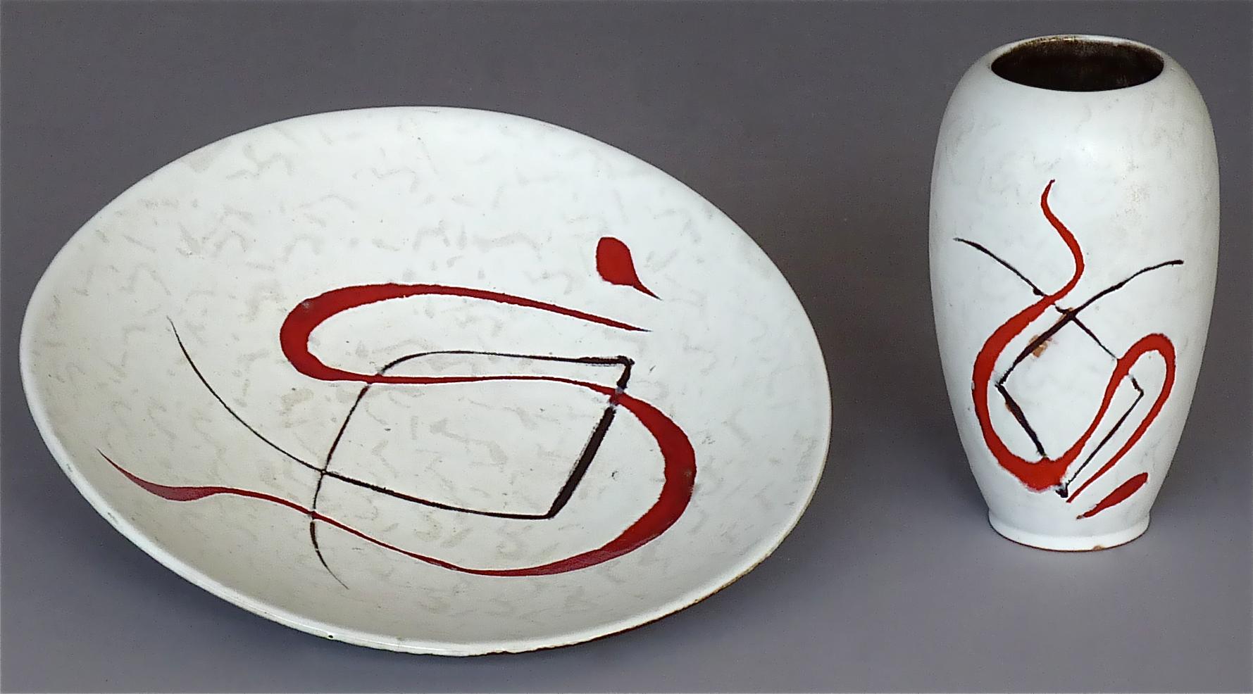 Midcentury abstract art ceramic vase and organic formed bowl probably, made in Italy, France or Germany, circa 1950. The ovoid vase and the rounded freeform big bowl have a mainly white and faint spotty grey glaze with a black and bright red