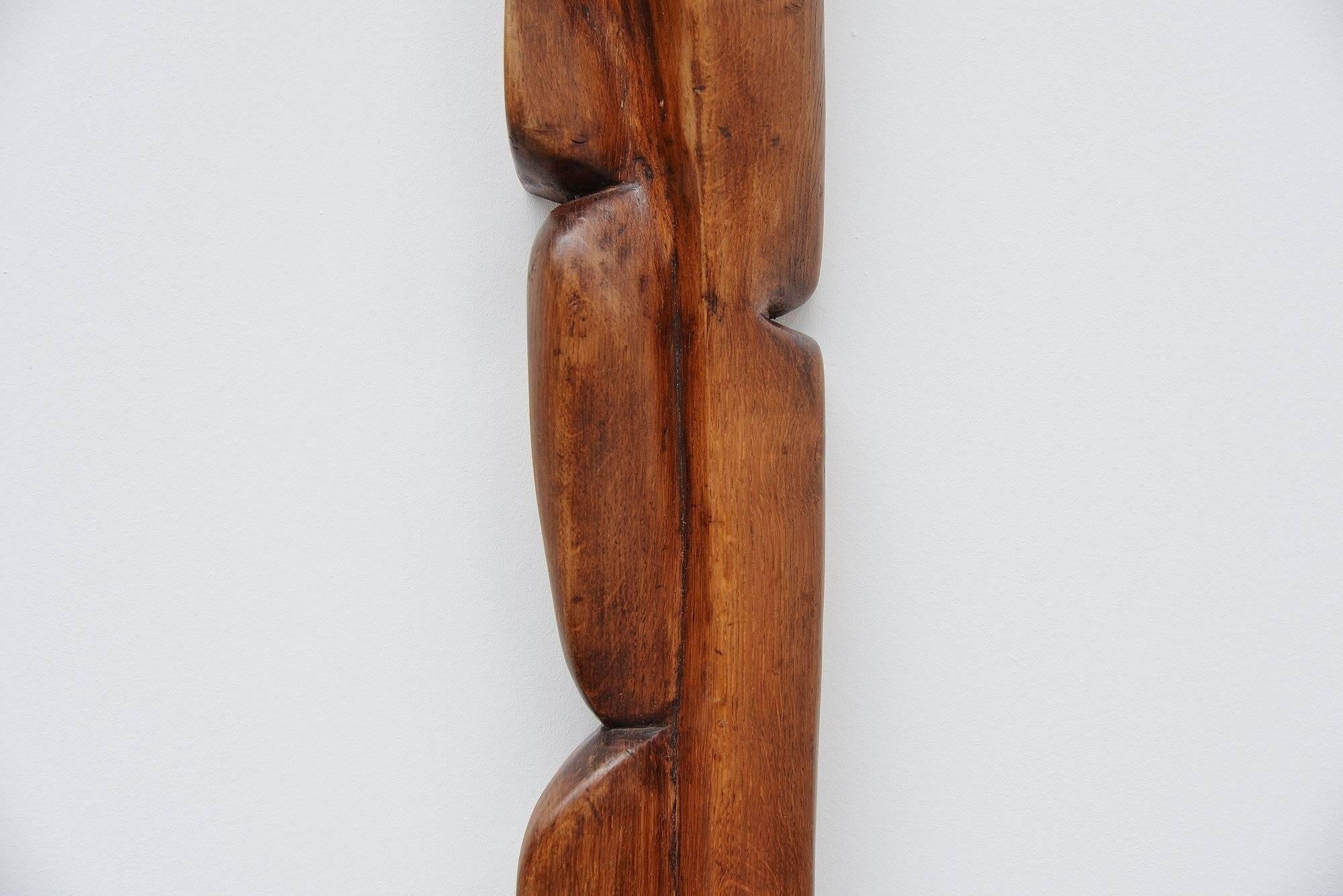 Beautiful wall mounted abstract modern sculpture, made in Belgium by unknown artist. This piece is signed MH 7-1983. This was purchased in Belgium so it must be a Belgian artist I am sure. The piece is made of handcrafted dark stained oak and has