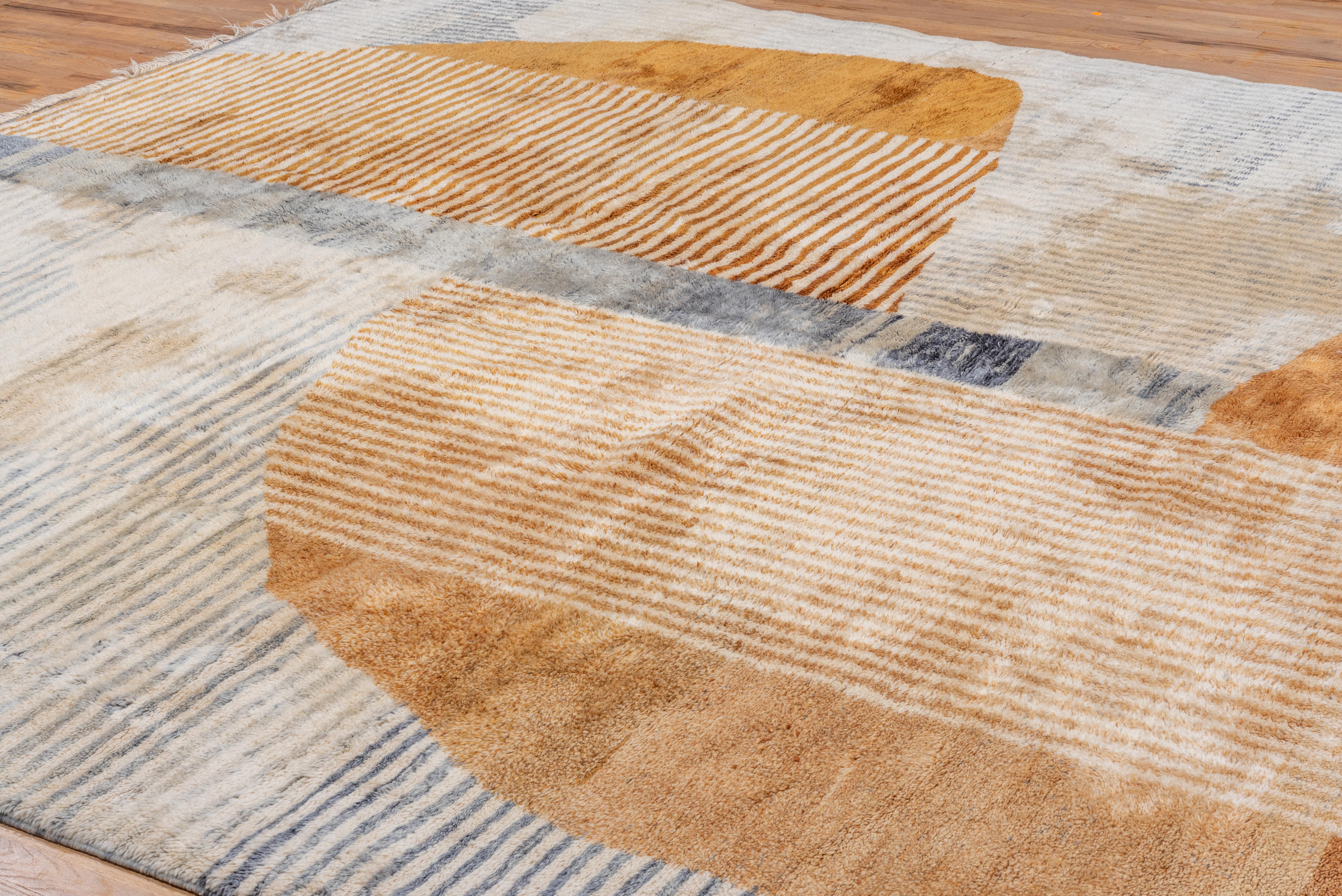 An Art Deco vibe is displayed in this beautiful Moroccan Rug. Stunning tones in coper, gray and ivory.
