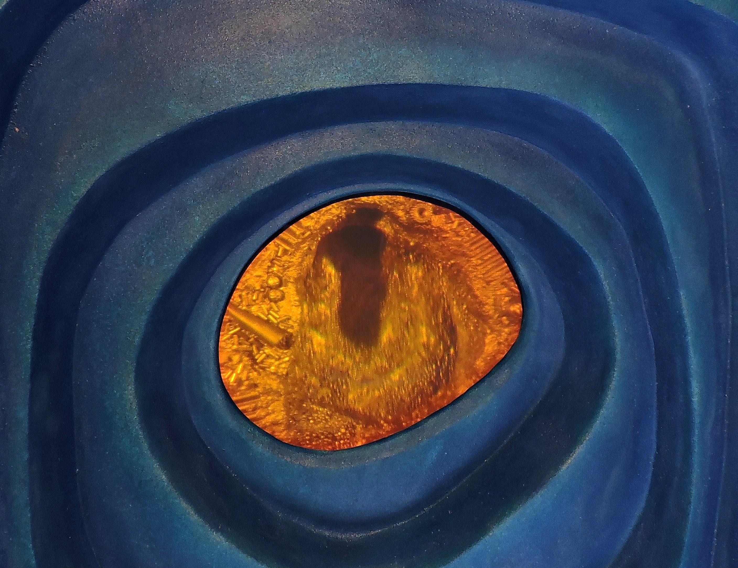 INTERIOR SPACES 1 is one of two abstract wall sculptures made of anodized aluminum combined with holography. This sculpture was sand cast in aluminum, then anodized in shades of blue, and has an inset glowing holographic image.

About this