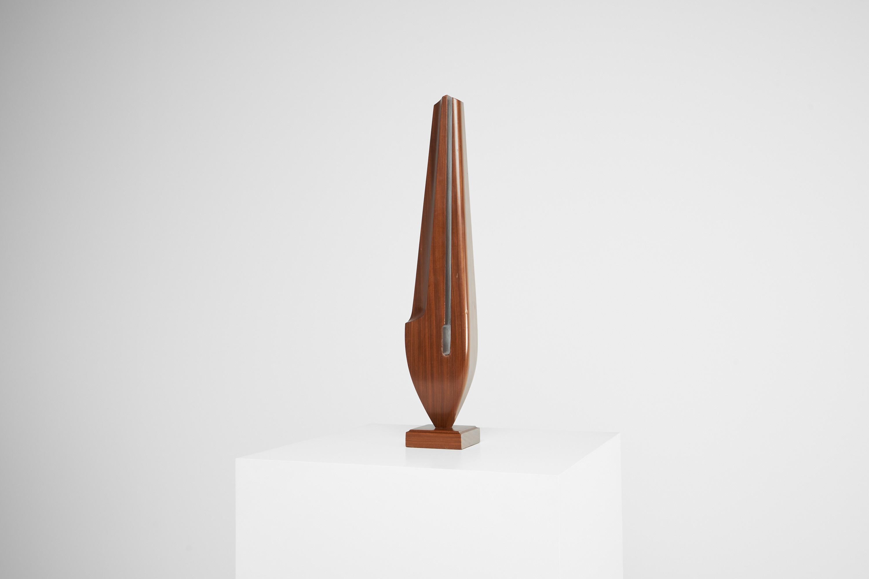 Very visually pleasing and interesting sculpture, made in France by unknown artist in 1960. This one of a kind piece is made out of solid teak wood with the pattern running vertically and has a light patina which makes it even look better.