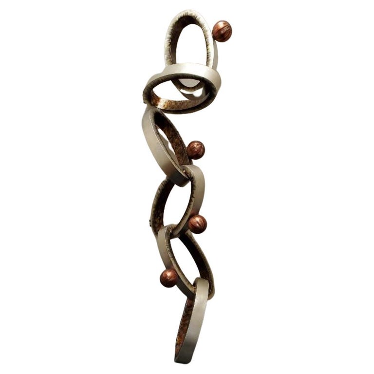 Abstract Modern Wall Art Sculpture of Interlocking Metal Ovals and Spheres For Sale at 1stDibs