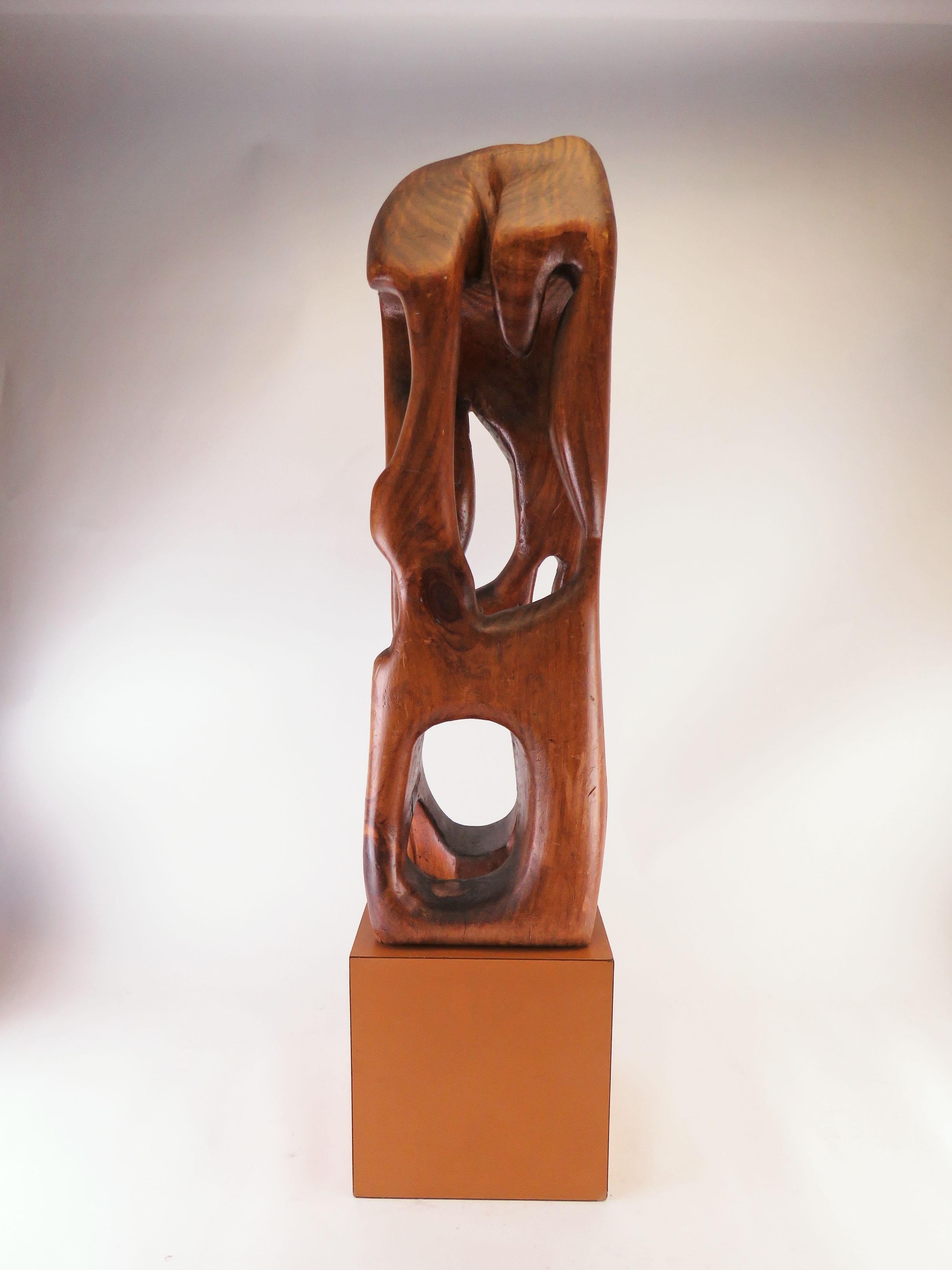 Abstract carved wood sculpture, circa 1960s, interesting from every angle. As found, upon a vintage 8