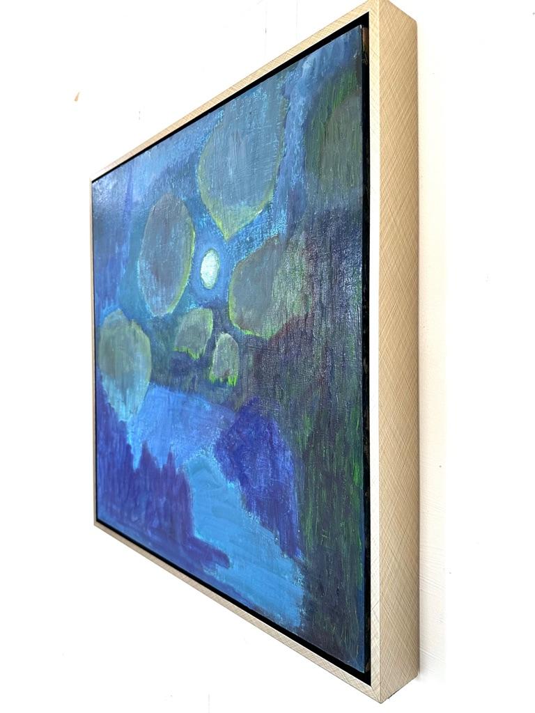 abstract moonlit landscape in various tones of blue, purple and green. textured painting surface reveals brush marks and under-layers. mixed media on panel, signed by the artist. framed in a crosshatched silver floater frame. painting is 12 x 12 and
