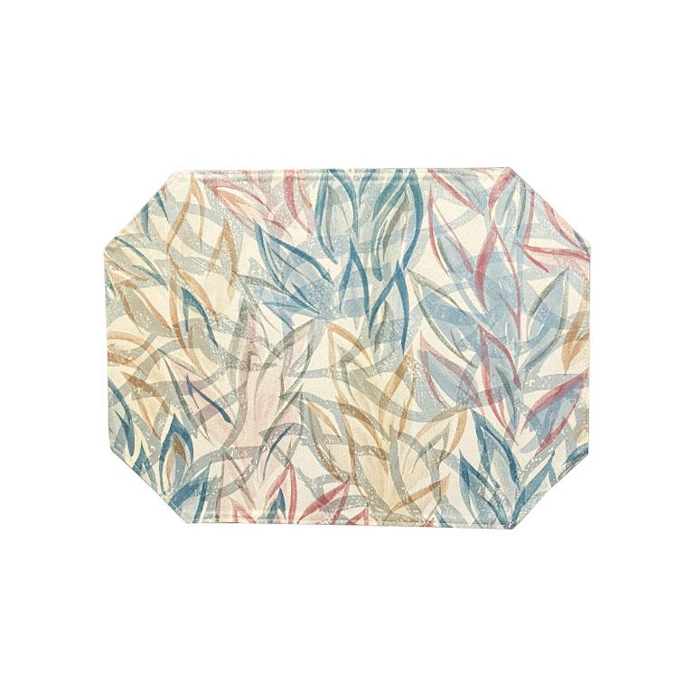 A set of four abstract octagonal placemats in pink, blue, and cream. This set features octagonal sides and is decorated in pink and blue brush strokes on a cream background. Perfect for your next dinner party. 

Dimensions:
16.5
