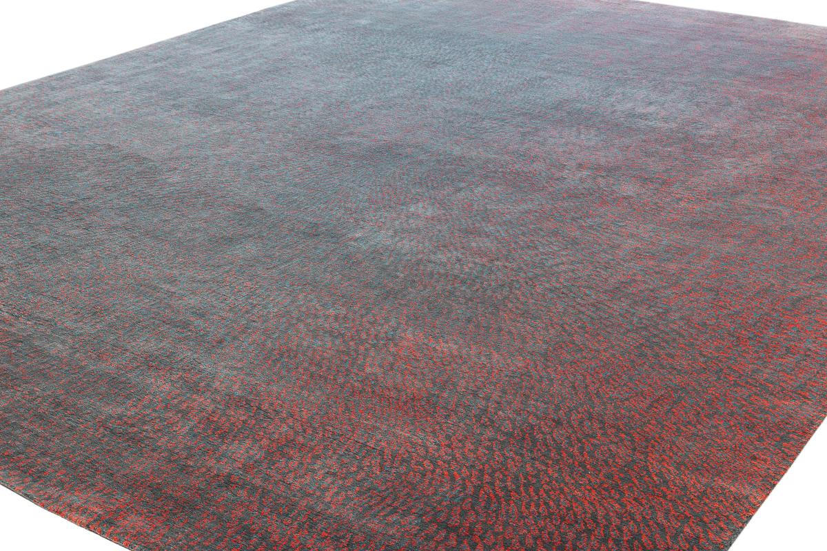 Dreampost is an incredible contemporary luxury carpet design by Joseph Carini. Drawing inspiration from stained glass, five colors of this rug melt together to create an aura of warmth. Shown here in 12 x 16 size with a moody combination of a dark