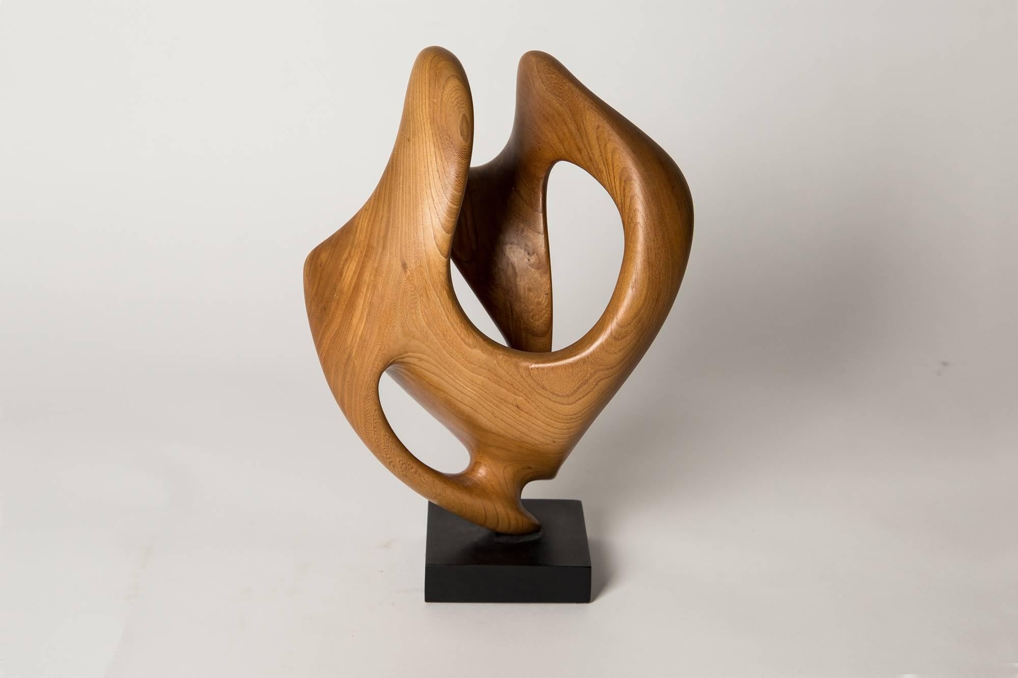 Hand-carved, sculpted from a single block of Elm.

The artist:
Born in Welwyn Garden City in 1944. Having exhibited mainly in Britain and a member of the exhilarating Hertfordshire Visual Art Form, sculpting for John is a natural activity in