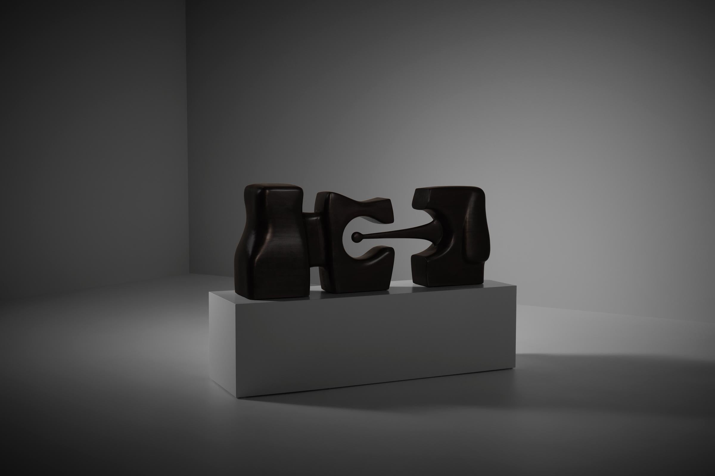 Large abstract organic wooden sculpture by B. van Beek (1946), The Netherlands 1970s. Made from light tropical wood with a beautiful linear grain and a soft and smooth surface, finished in a very dark chocolate brown wax staining. Elegent yet strong