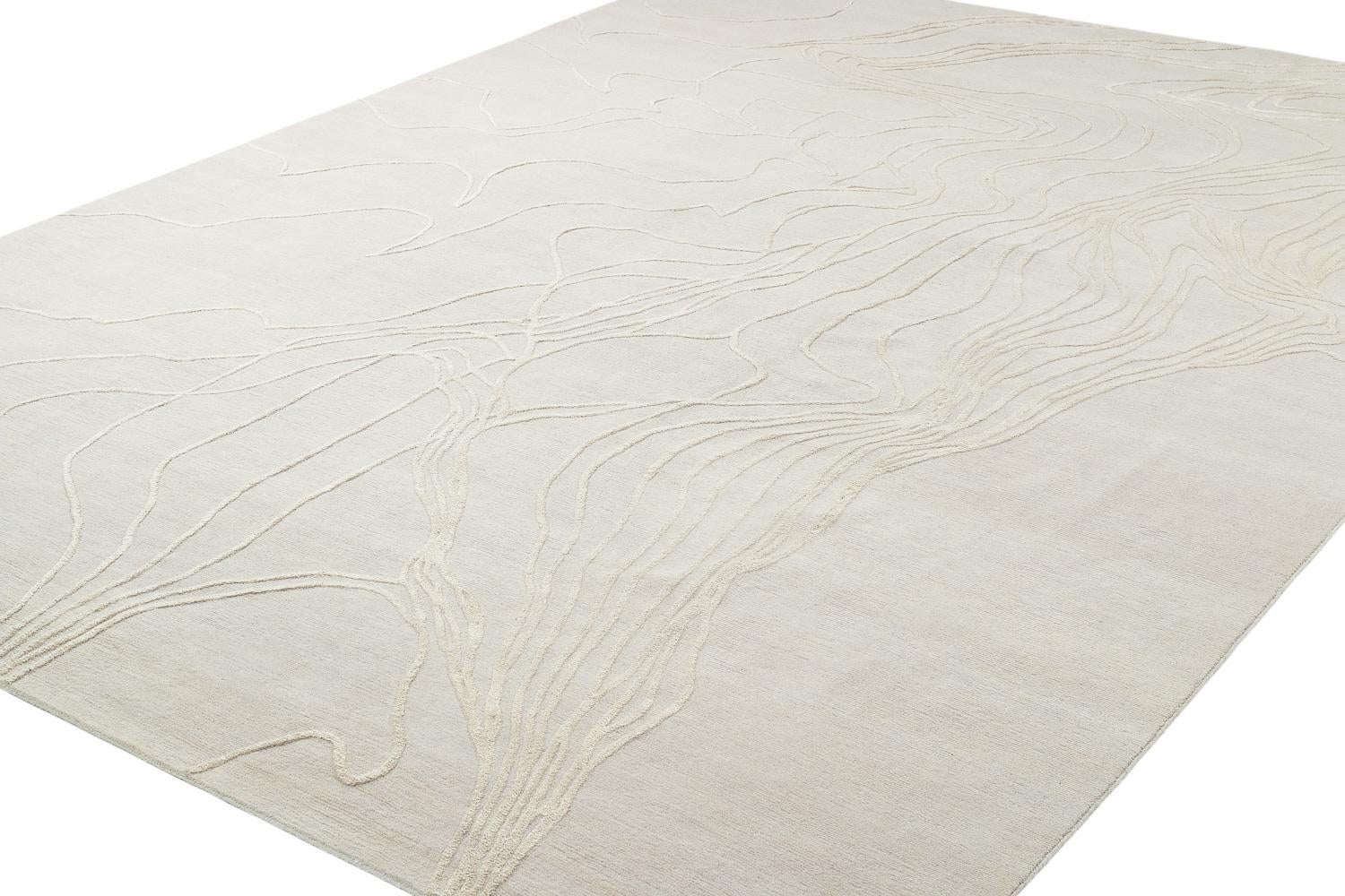 Topop's appeal is it's subtle texture and elegant composition. On a field of rich wool, wavy lines of silk and wool create abstract shapes and designs. The materials of this carpet can be changed, as well as the color palette. Tone-on-tone or