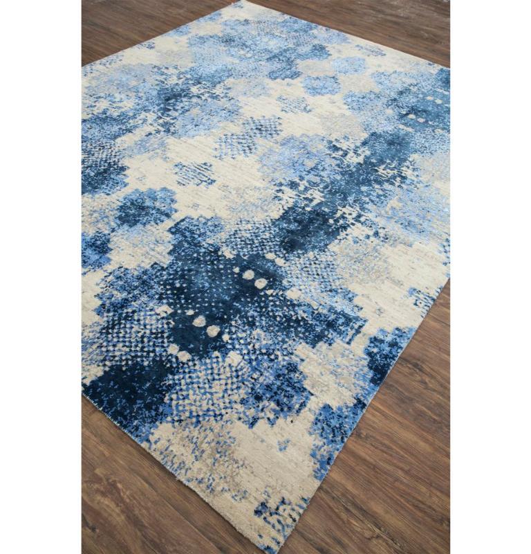In the dance of errors and the gentle intrusion of nature into mechanized precision, this contemporary rug transcends conventional design. A captivating study of misprints unfolds, revealing a unique masterpiece at the intersection of nature and