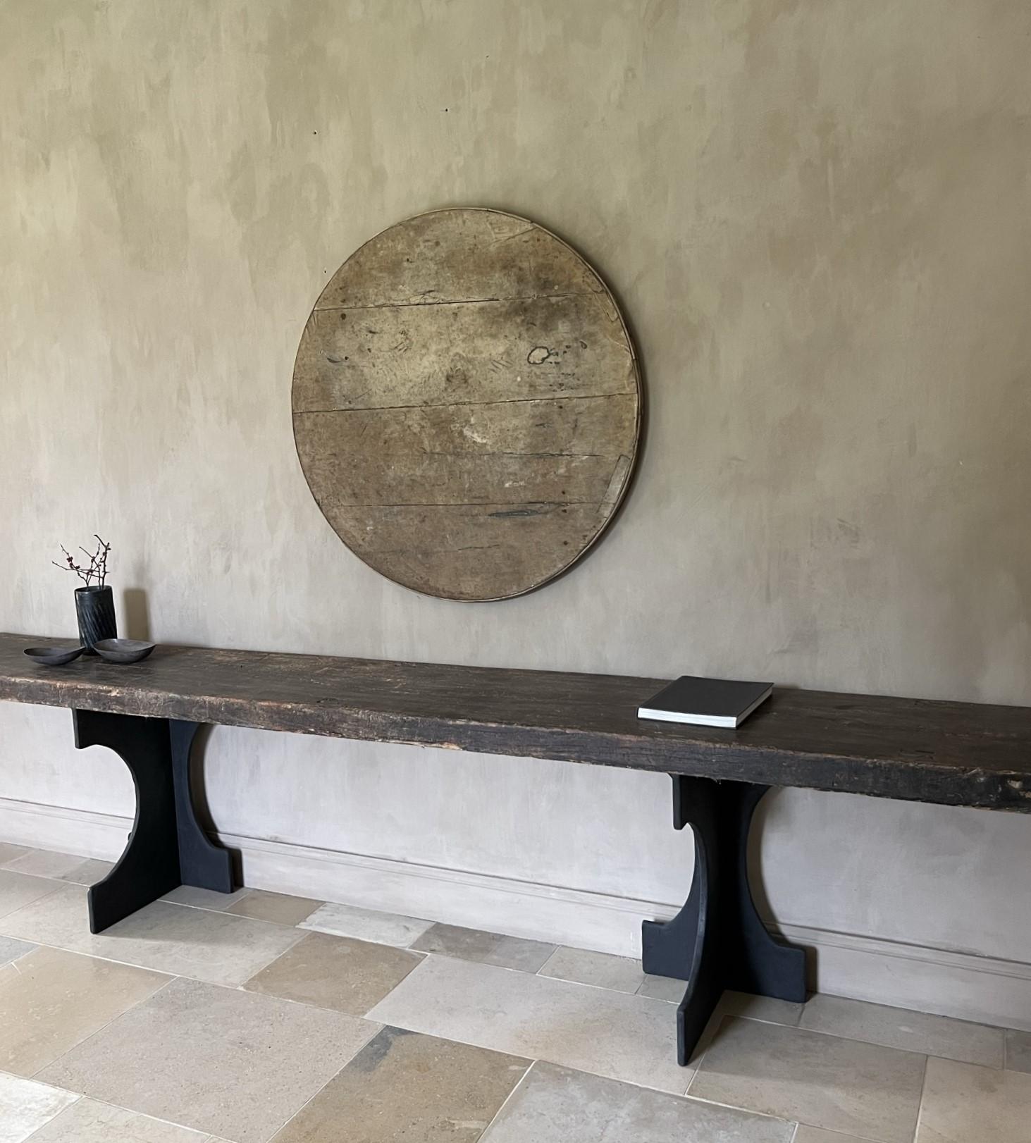 A reclaimed 19th century wine tabletop with a beautiful original canvas top. Soft cream colour with faded original toile.  Displayed as a painting its a fine example of art made by time.
