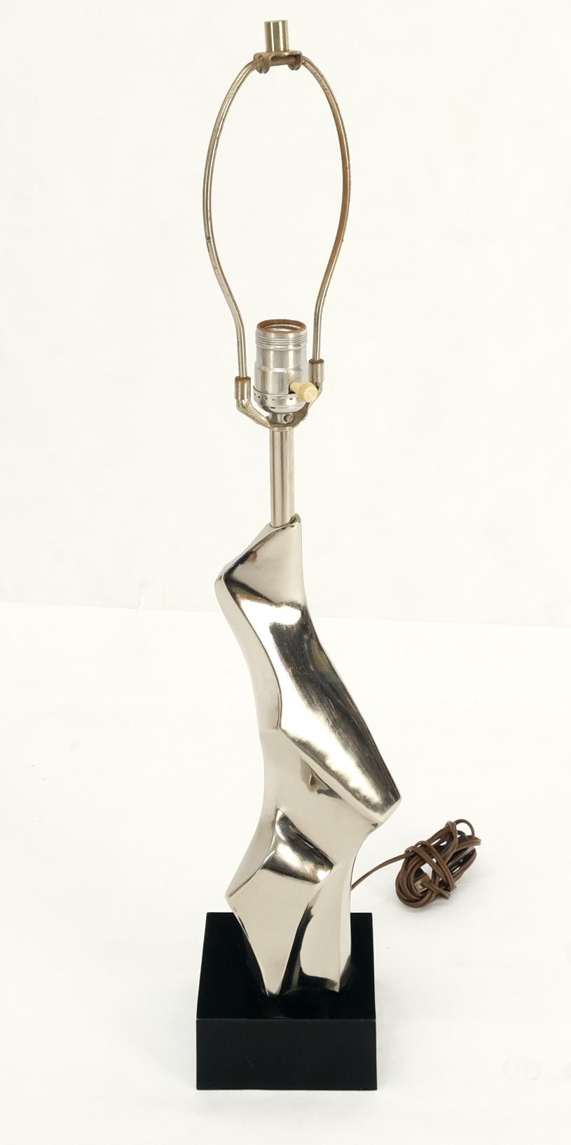 Mid-Century Modern quality craftsmanship abstract polished metal sculpture table lamp on a square marble base.