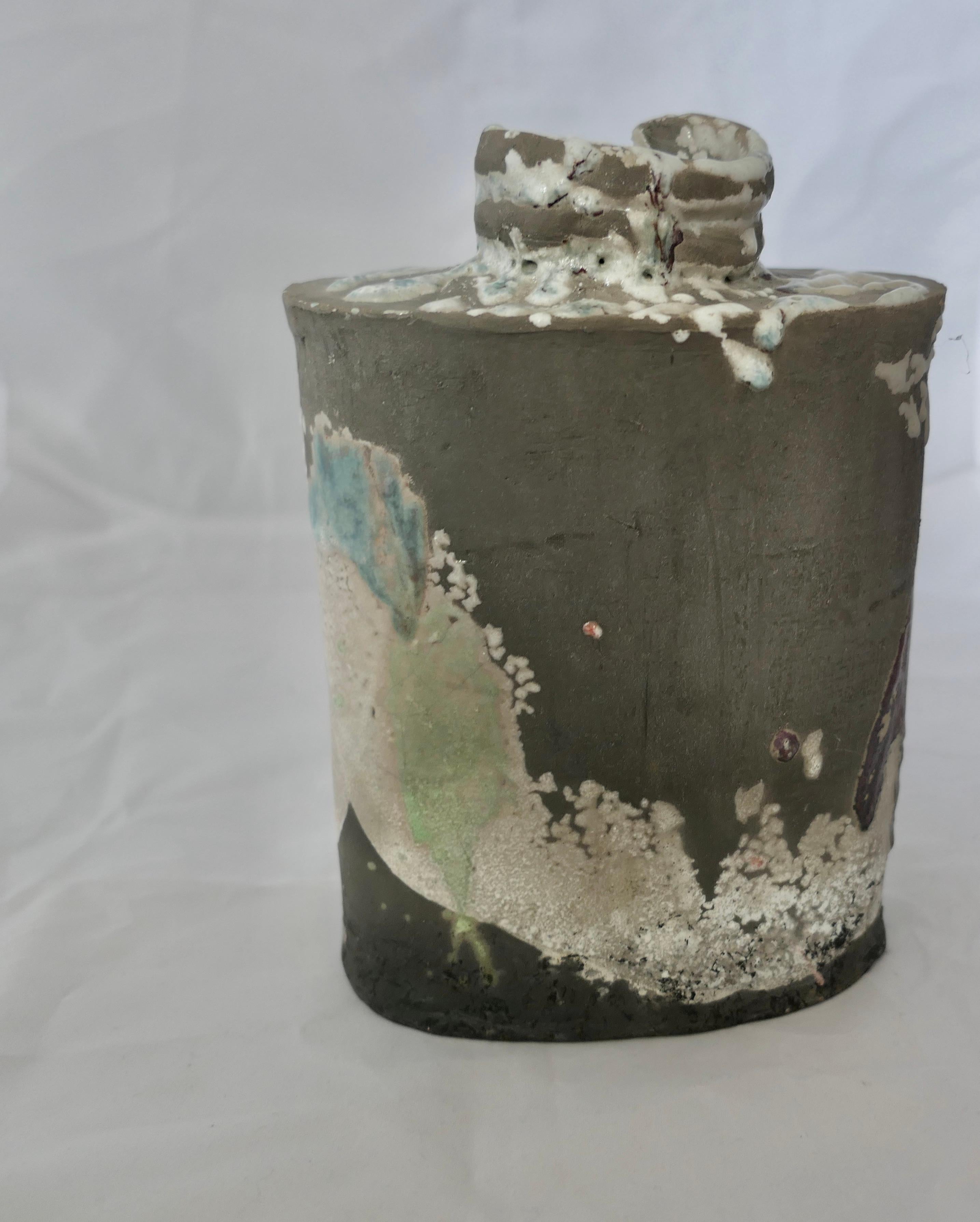 Abstract Polychrome Stoneware Vase of  Signed PH, Phill Rogers
A impressive notable piece, the flask has slightly curved sides, it is 9.5” high, 7” wide and 4” deep
NG69