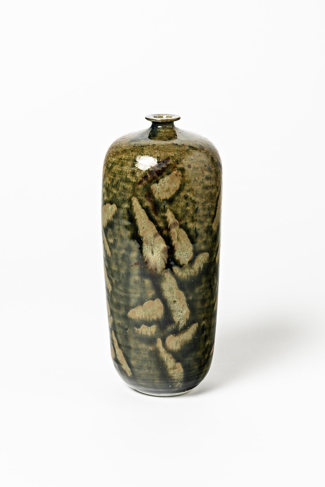 Robert Héraud et Annie Maume

Réalisé à La Borne vers 1970

Élégante bouteille en céramique de porcelaine avec des couleurs abstraites d'émaux de céramique bruns et verts.

Conditions originales parfaites

Signé sous la base

Mesures :