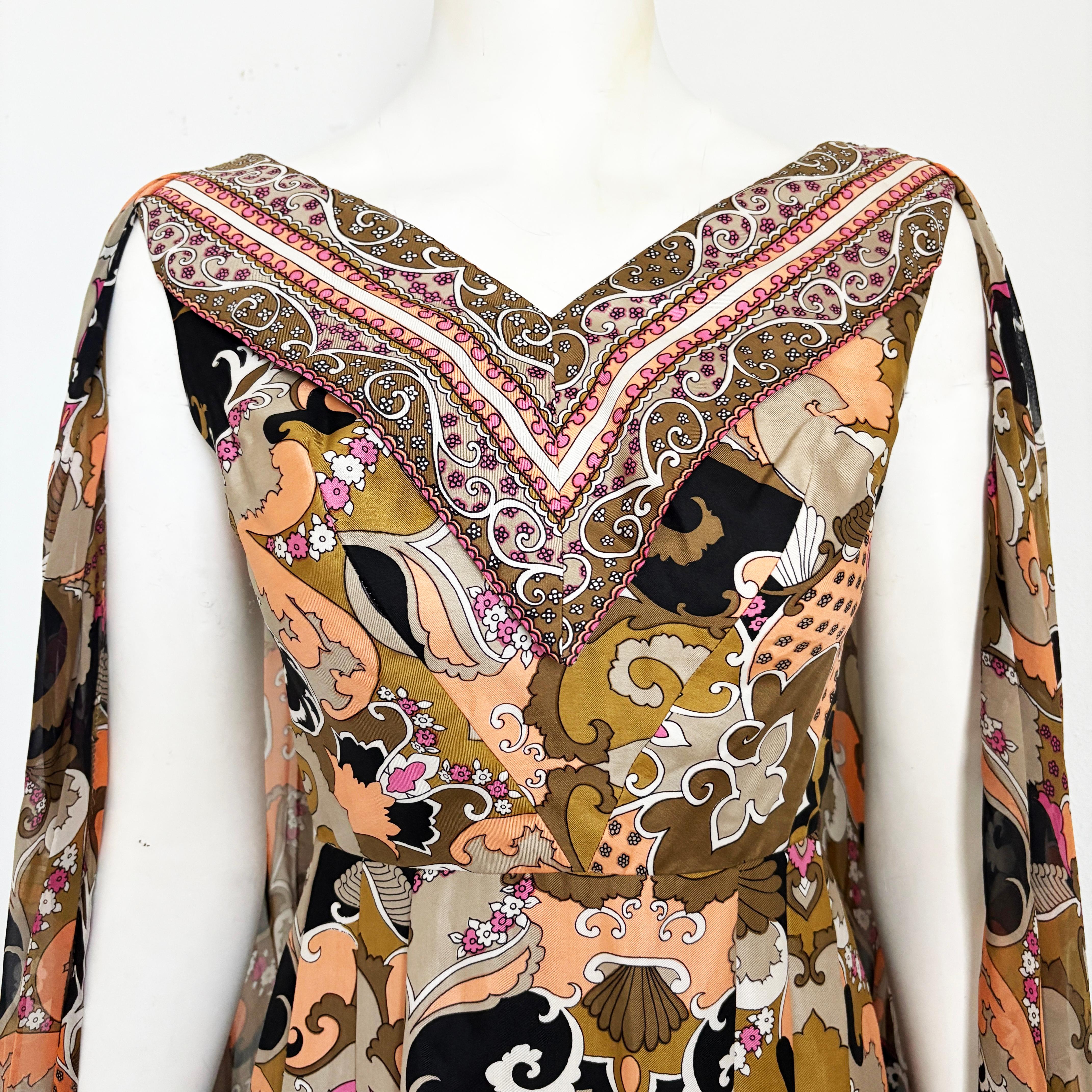 Preowned, vintage dress, originally sold by Robert W Gates Burlingame CA, most likely in the 1970s.  Made from lightweight twill fabric (no content label, feels synthetic), it features a wonderful 