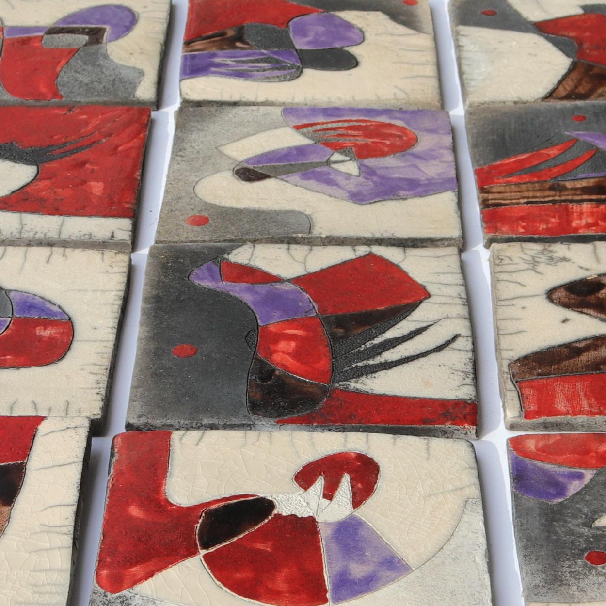 A beautiful tile panel with abstract shapes in red and purple colors. This panel consists of 20 tiles, handmade by Antonietta Capecchi according the traditional Japanese Raku technique.

Raku ware is a type of Japanese pottery traditionally used in