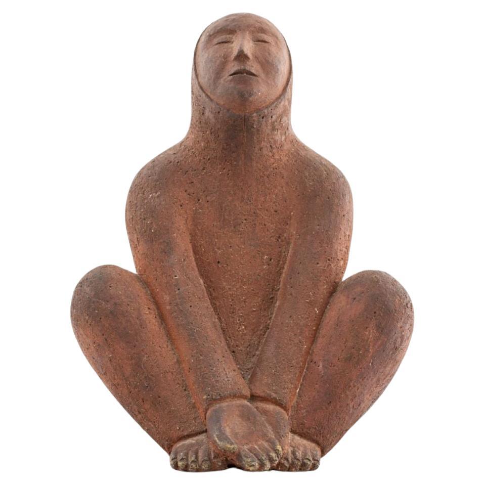 Abstract Red Clay Sculpture Of A Seated Figure For Sale
