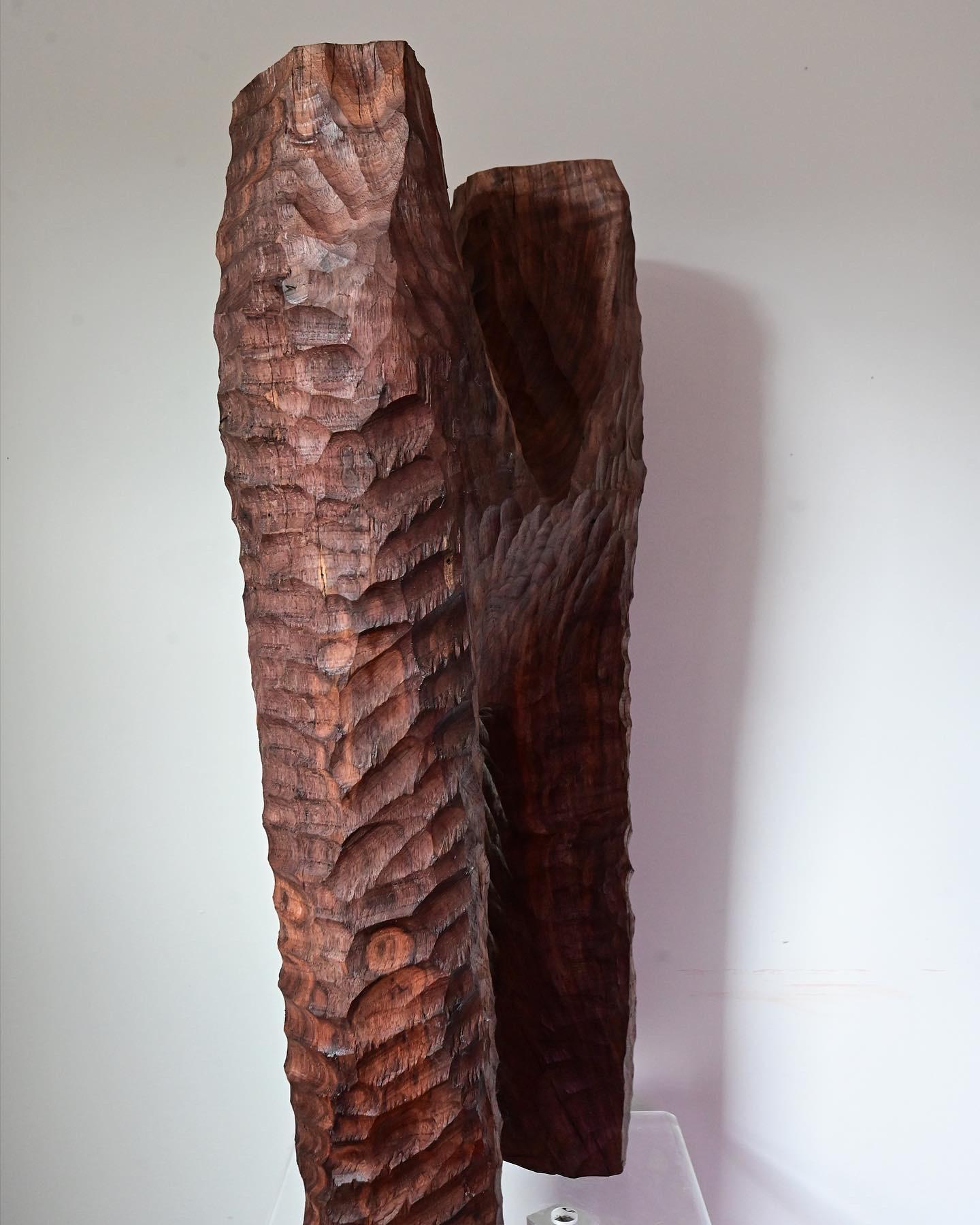 Original hand carved sculpture from a solid piece of walnut. Piece is done in a brutalist style with exposed hand tool markings. Has semi smooth texture with a durable hard wax finish. Measures 28