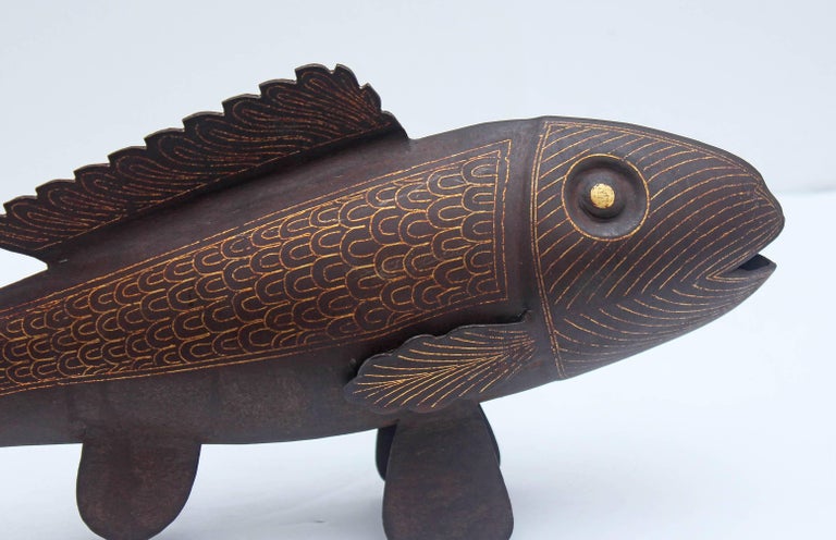 A striking metal sculpture of a fish. Iron with gold gilt decoration. Probably Asian.