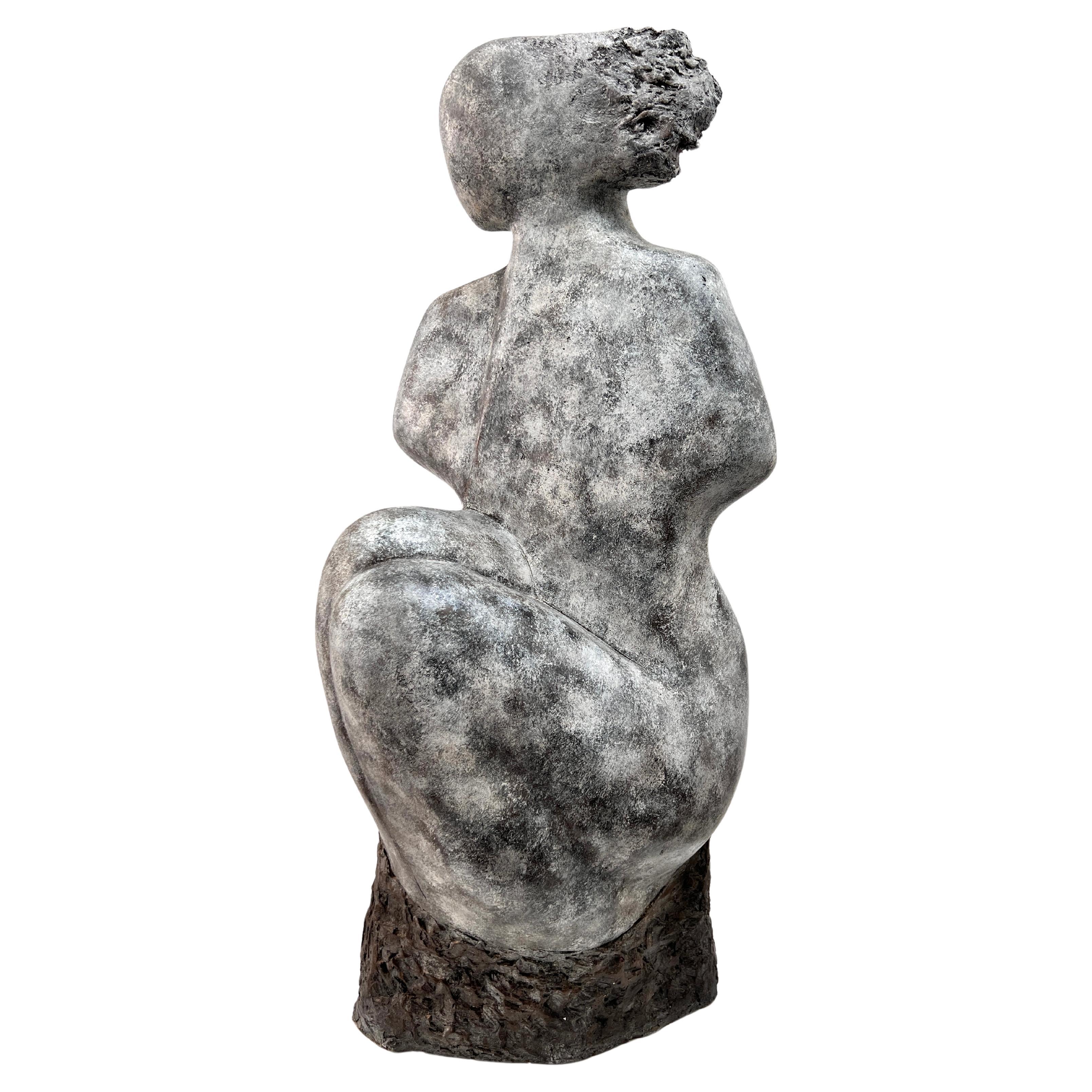 Abstract sculpture of a seated woman, one of a kind, cast