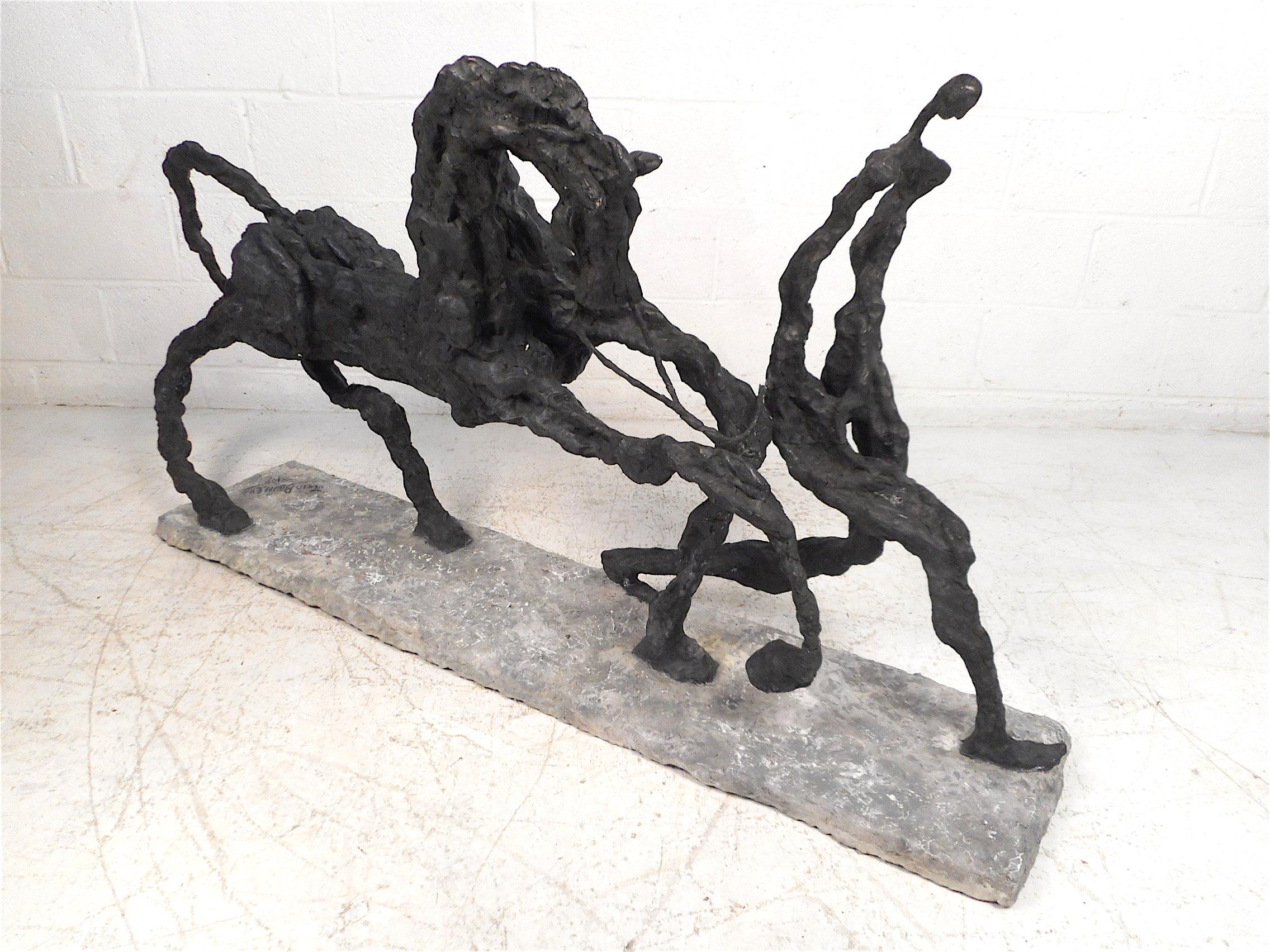 Stunning abstract horse sculpture made by Venezuelan-American artist Julio Aguilera. Interesting representations of a horse being led by its human companion. This sculpture is sure to add a lively dimension to any room where it is displayed. Please