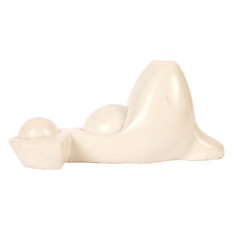 This minimal and interpretive sculpture is of a pregnant expectant mother laying on her back with her knees up. It is signed, dated and titled “Maternité.”.