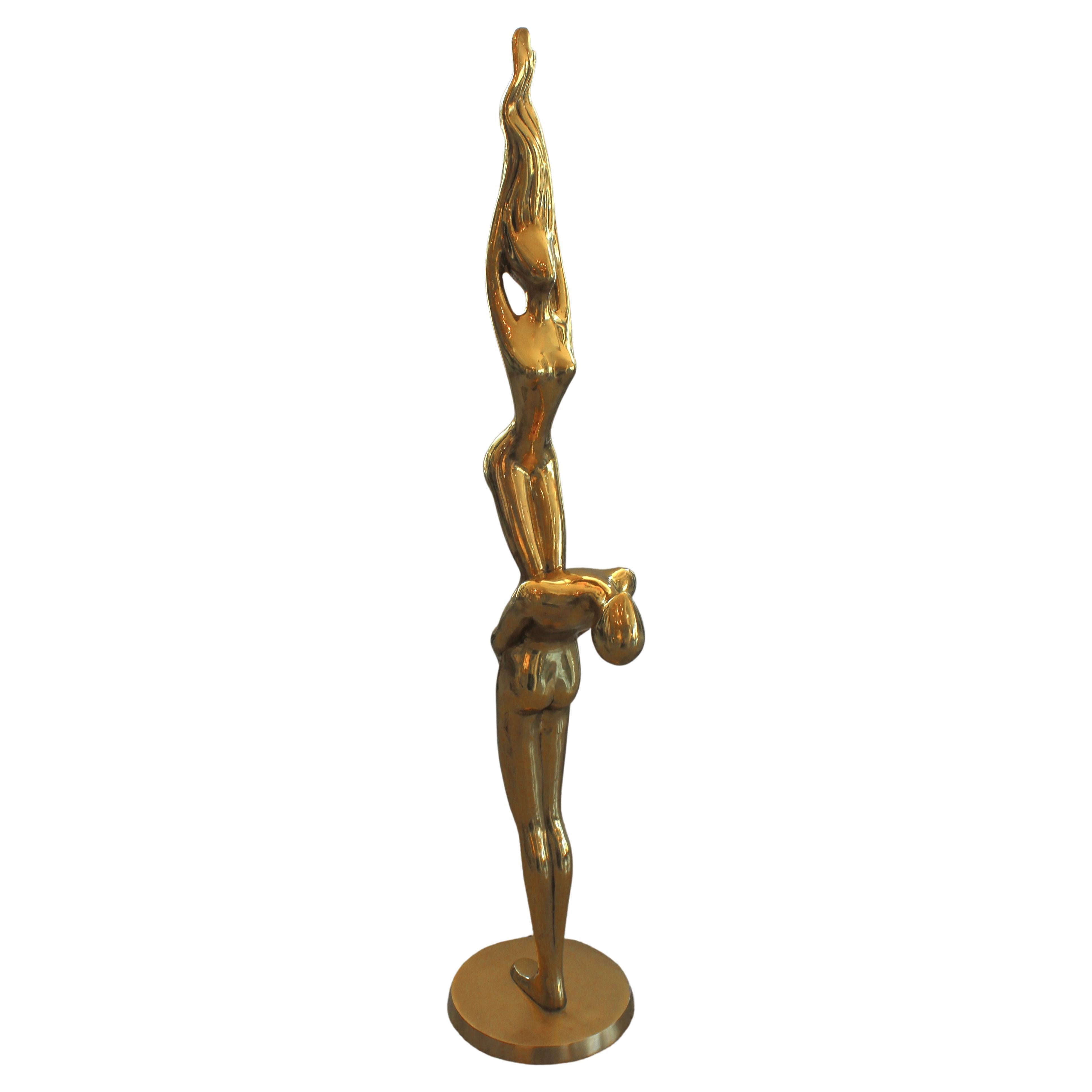 Thi stylish and chic 1970s sculpture depicting two stylized nude acrobatic figures will make a statement with its large scale, form and use of materials.

Note: The base is in a satin finish and the sculpture itself in a natual, patinated finish.